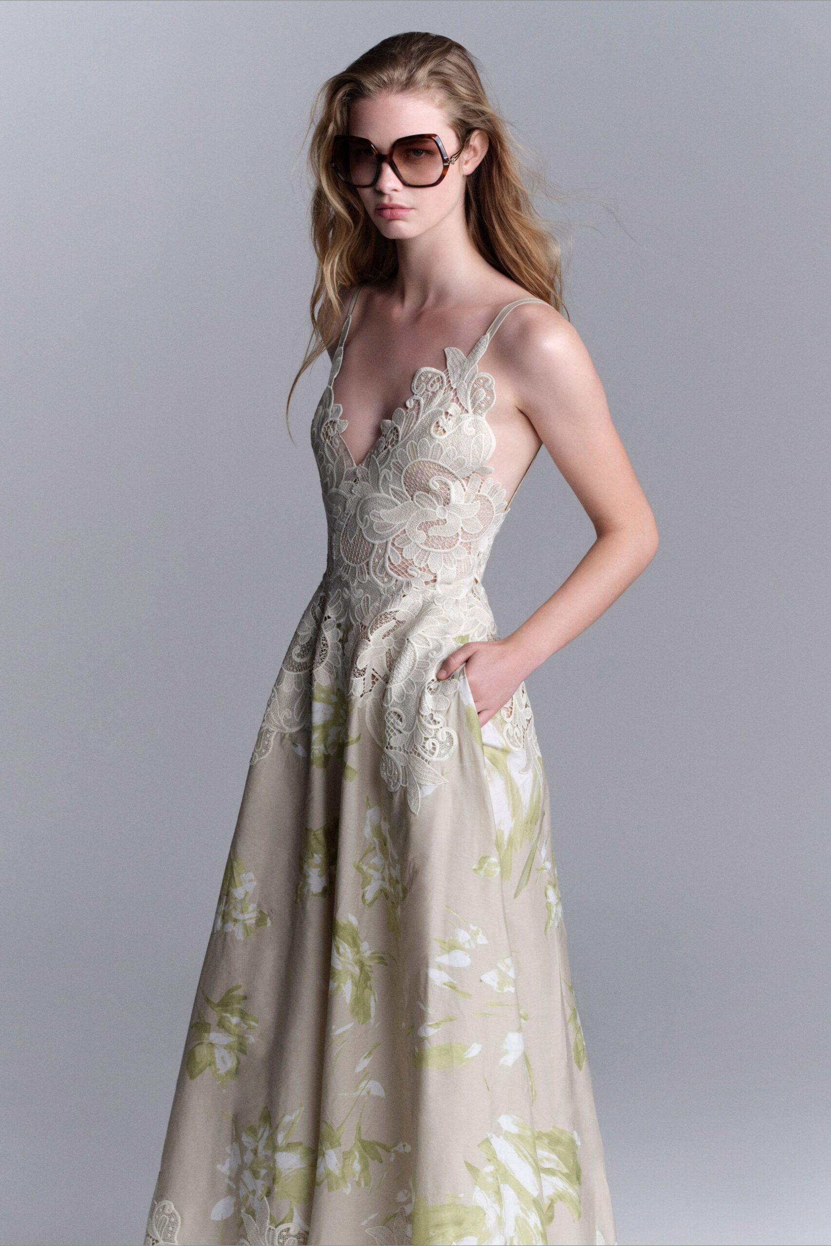 beige silk sleeveless v-neck fitted floral pleated gown