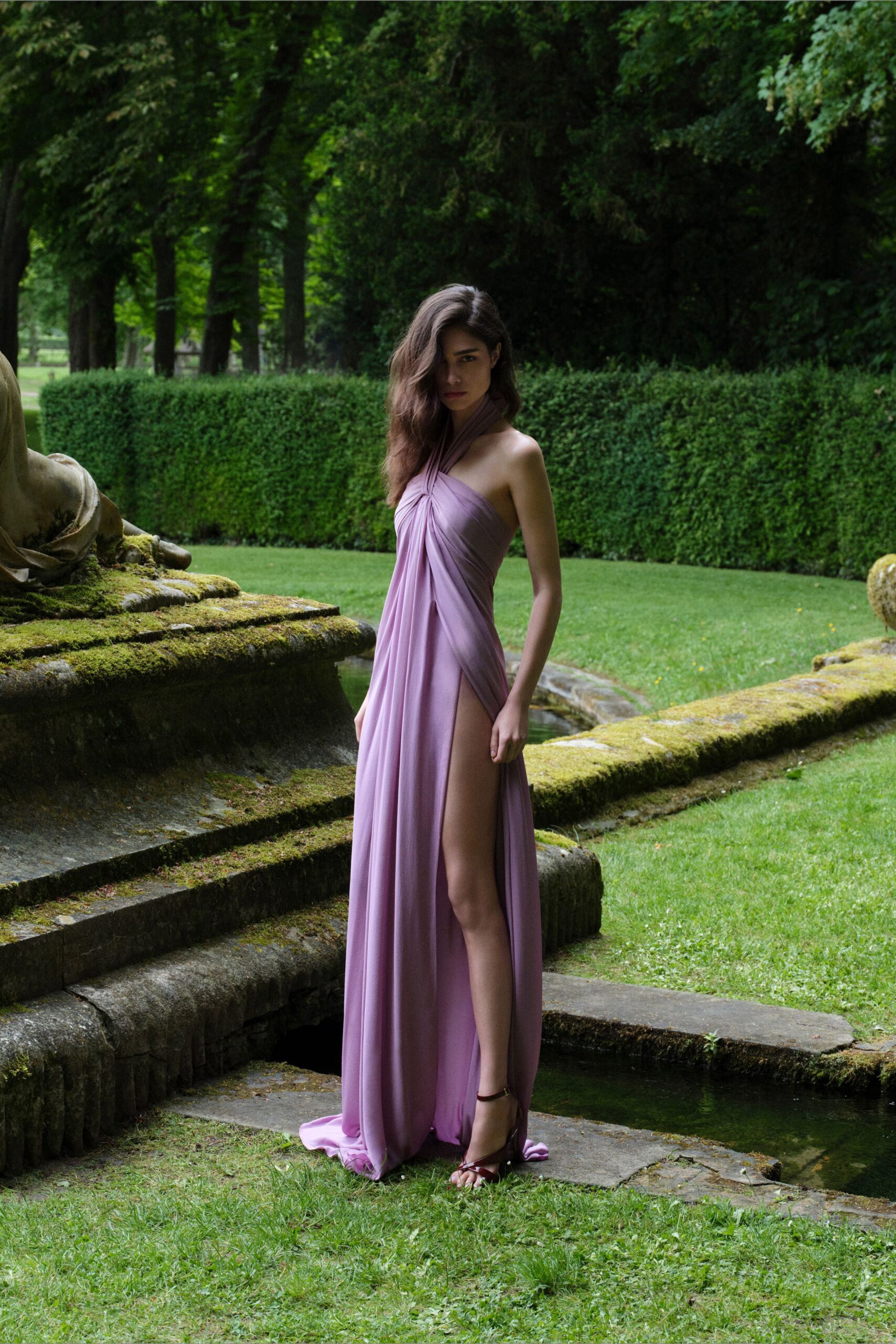 purple silk sleeveless v-neck fitted draped flowing gown