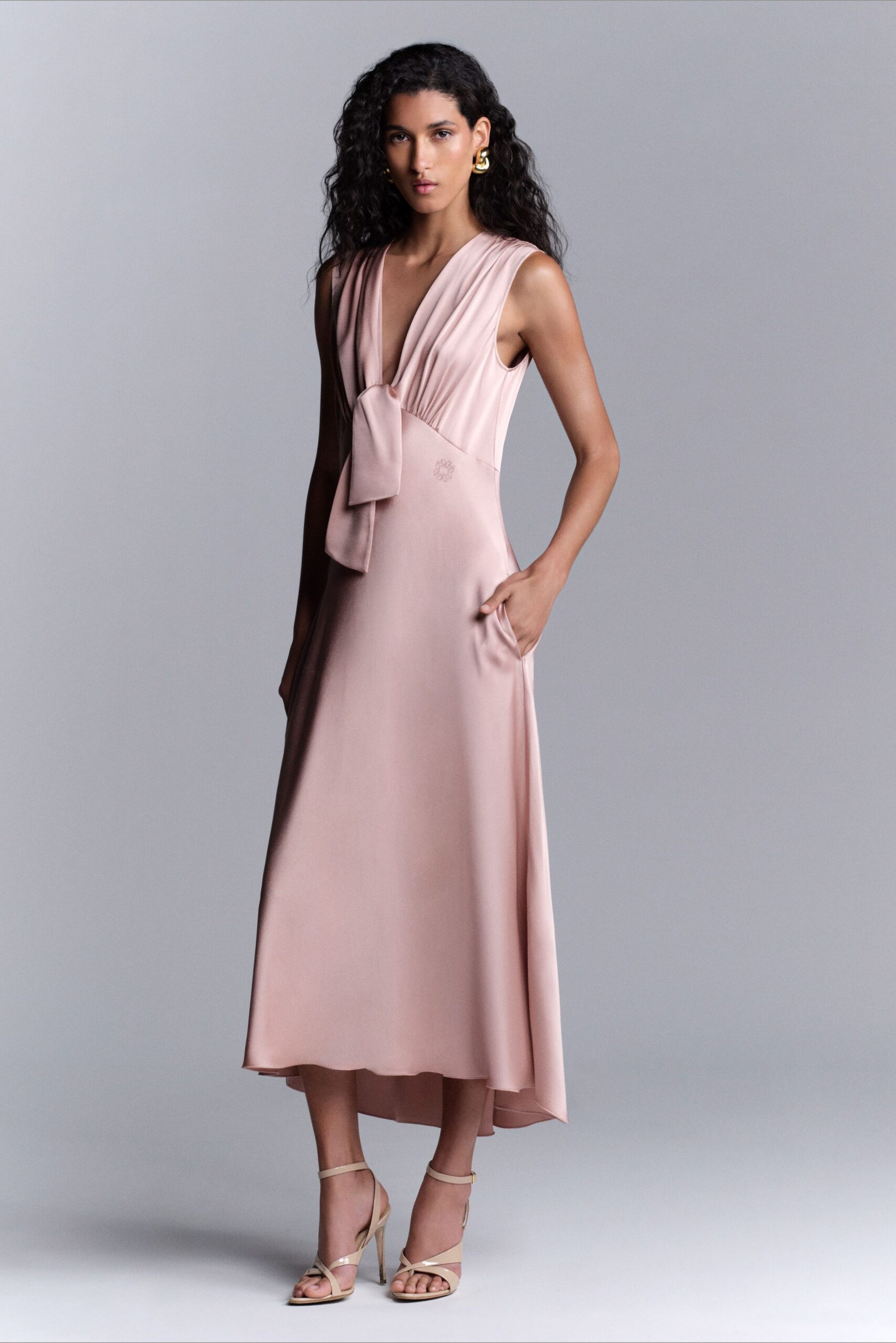 pink silk sleeveless v-neck fitted draped pockets dress