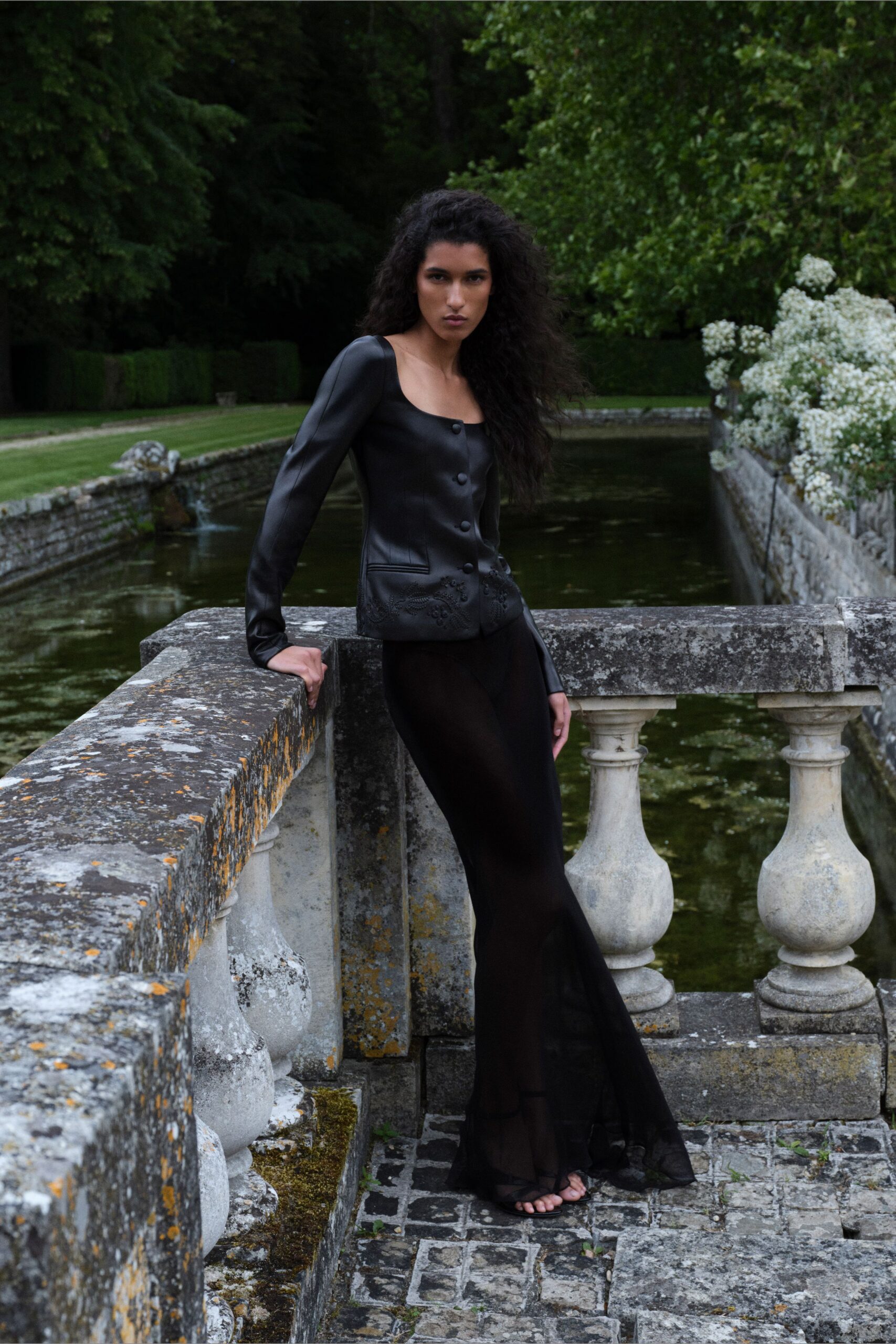 black sleeveless fitted layered sheer flowing maxi gown