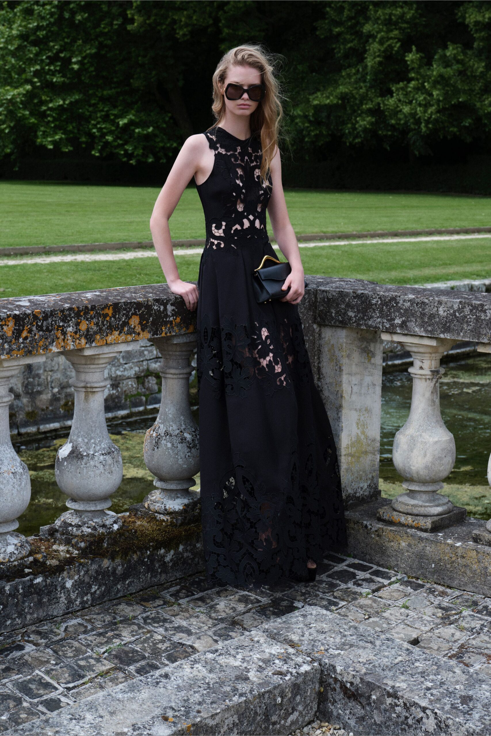 black lace sleeveless high-neck fitted embroidered tiered gown