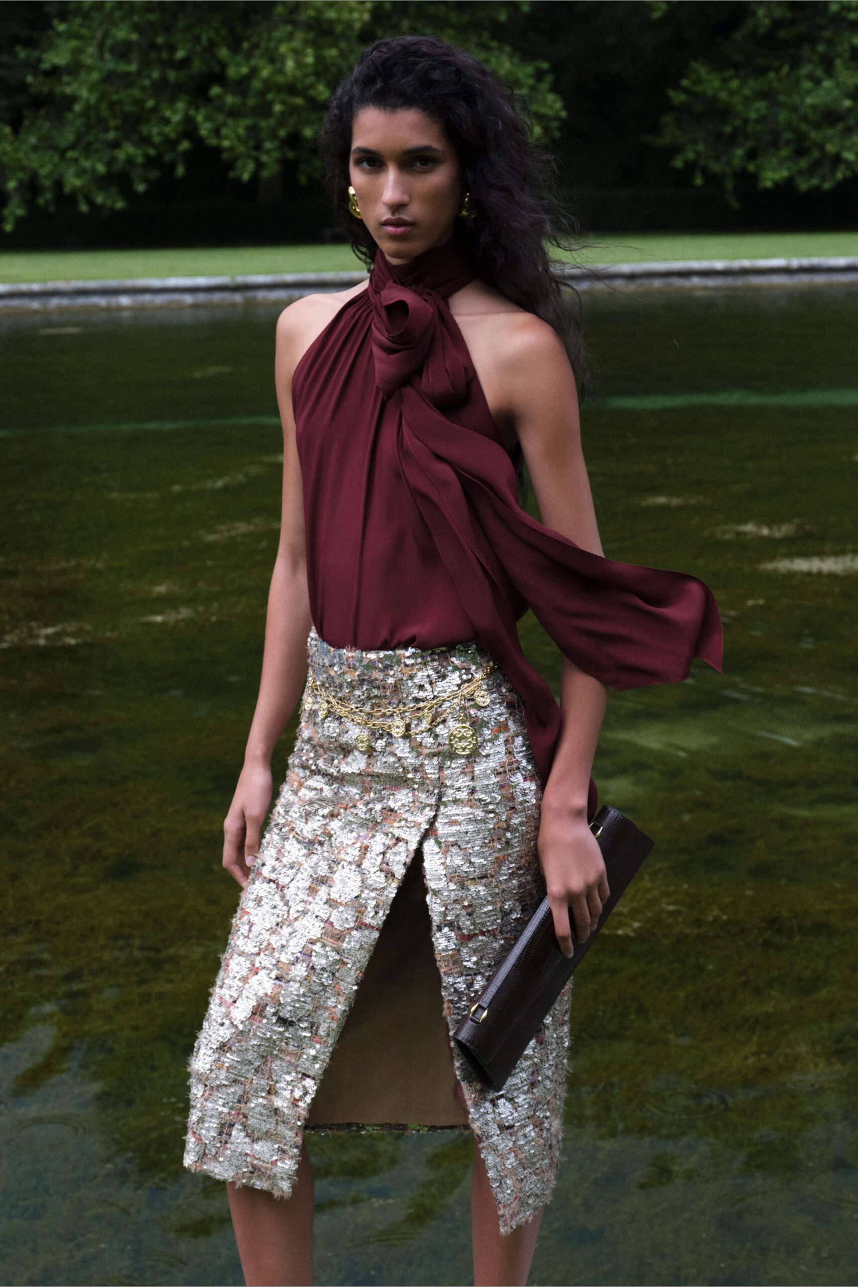 red silk sleeveless high-neck fitted draped top