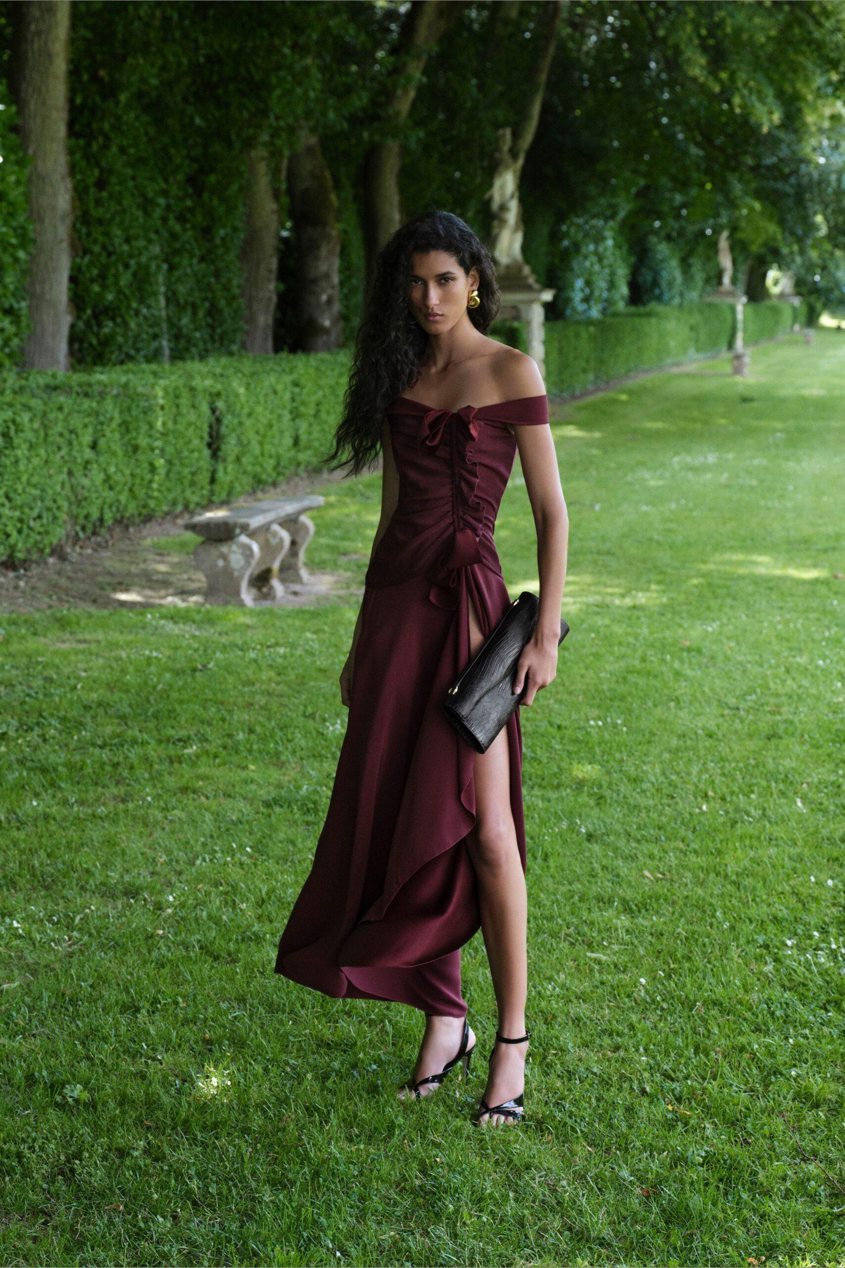 maroon silk off-shoulder slit fitted ruched flowing gown