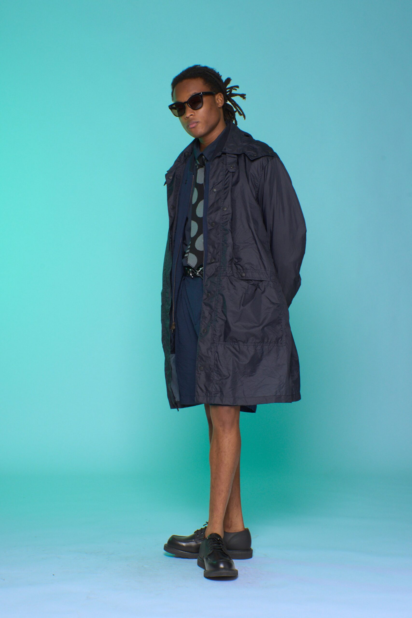 black coat with sunglasses