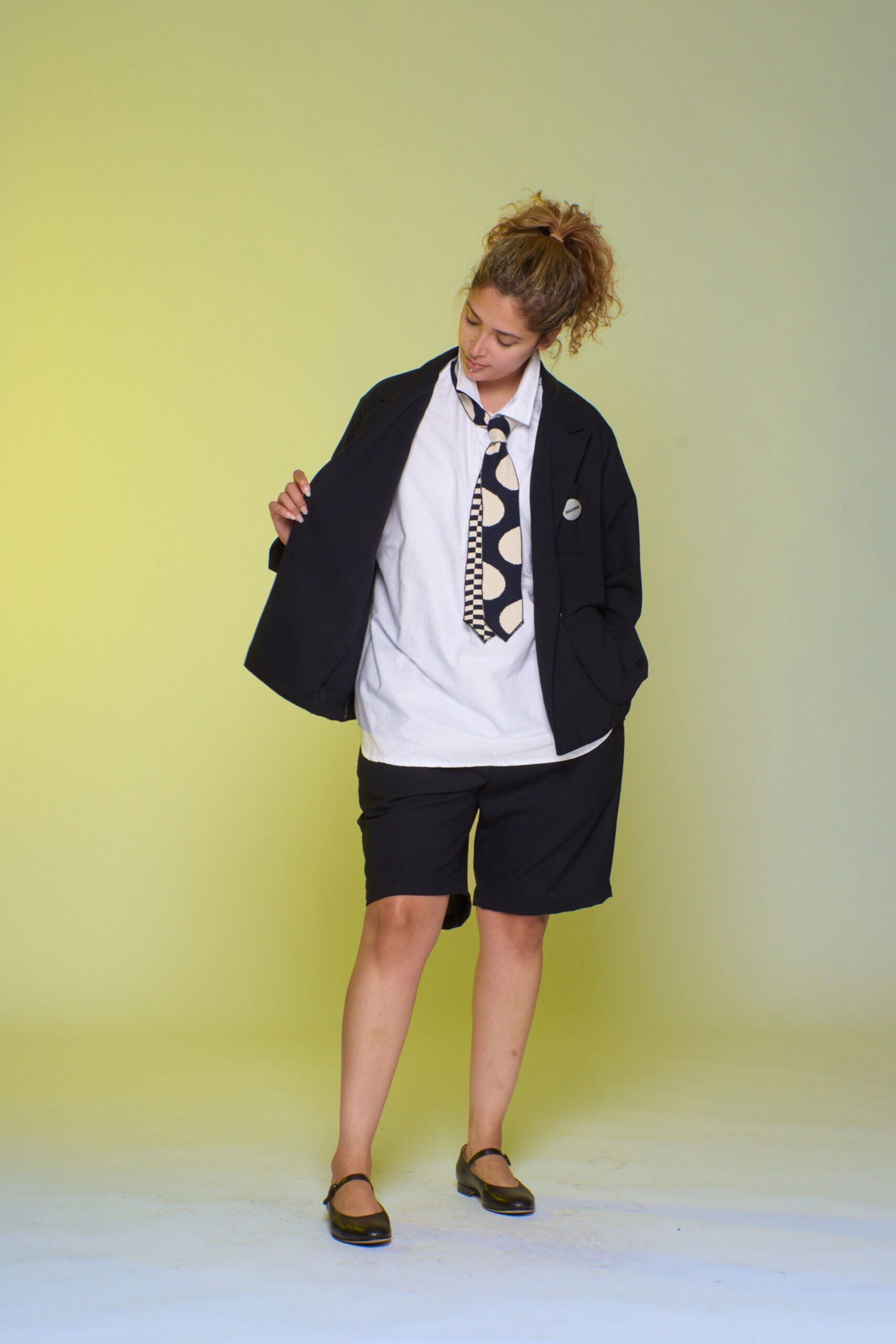 black blazer white shirt black shorts