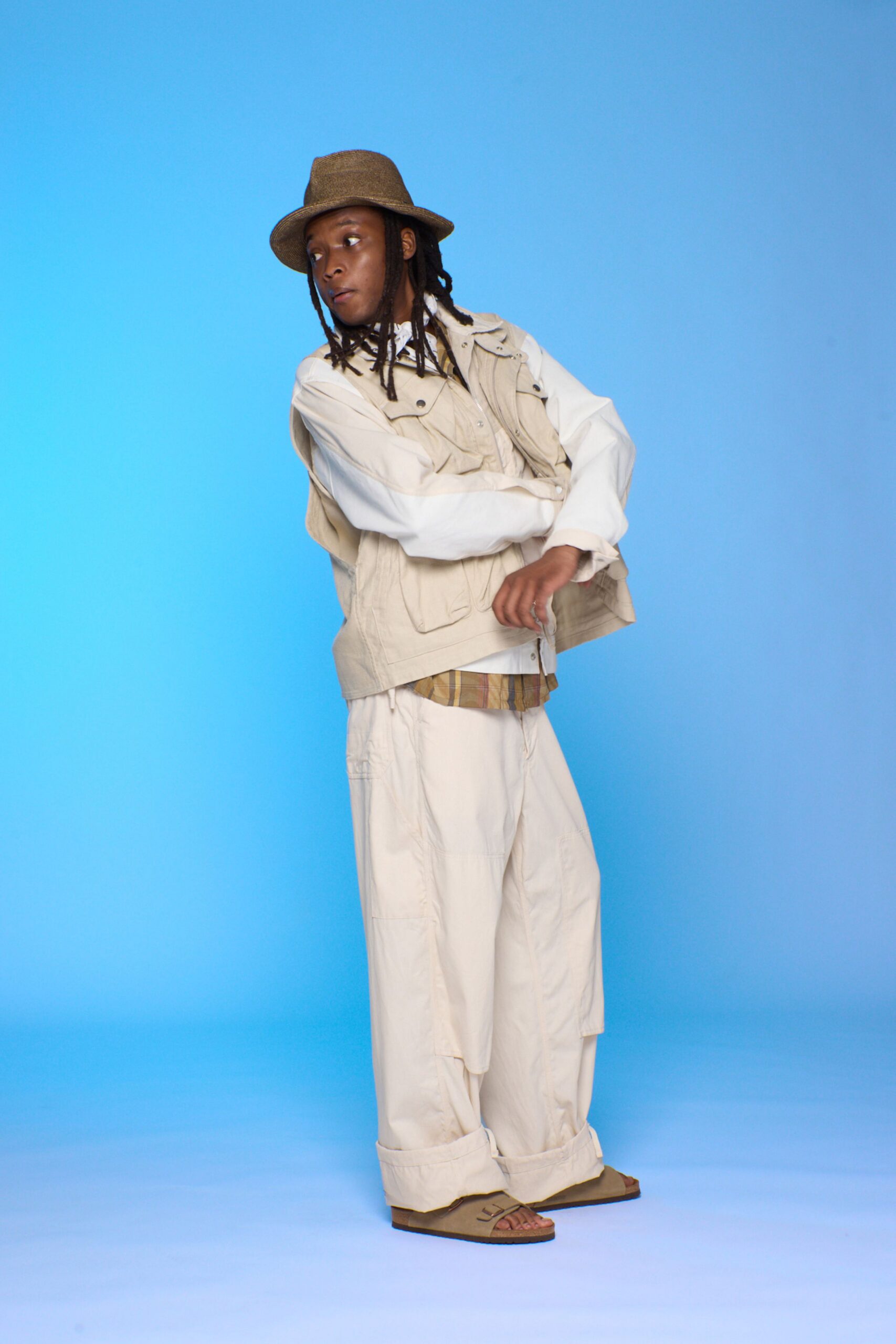beige vest with relaxed pants