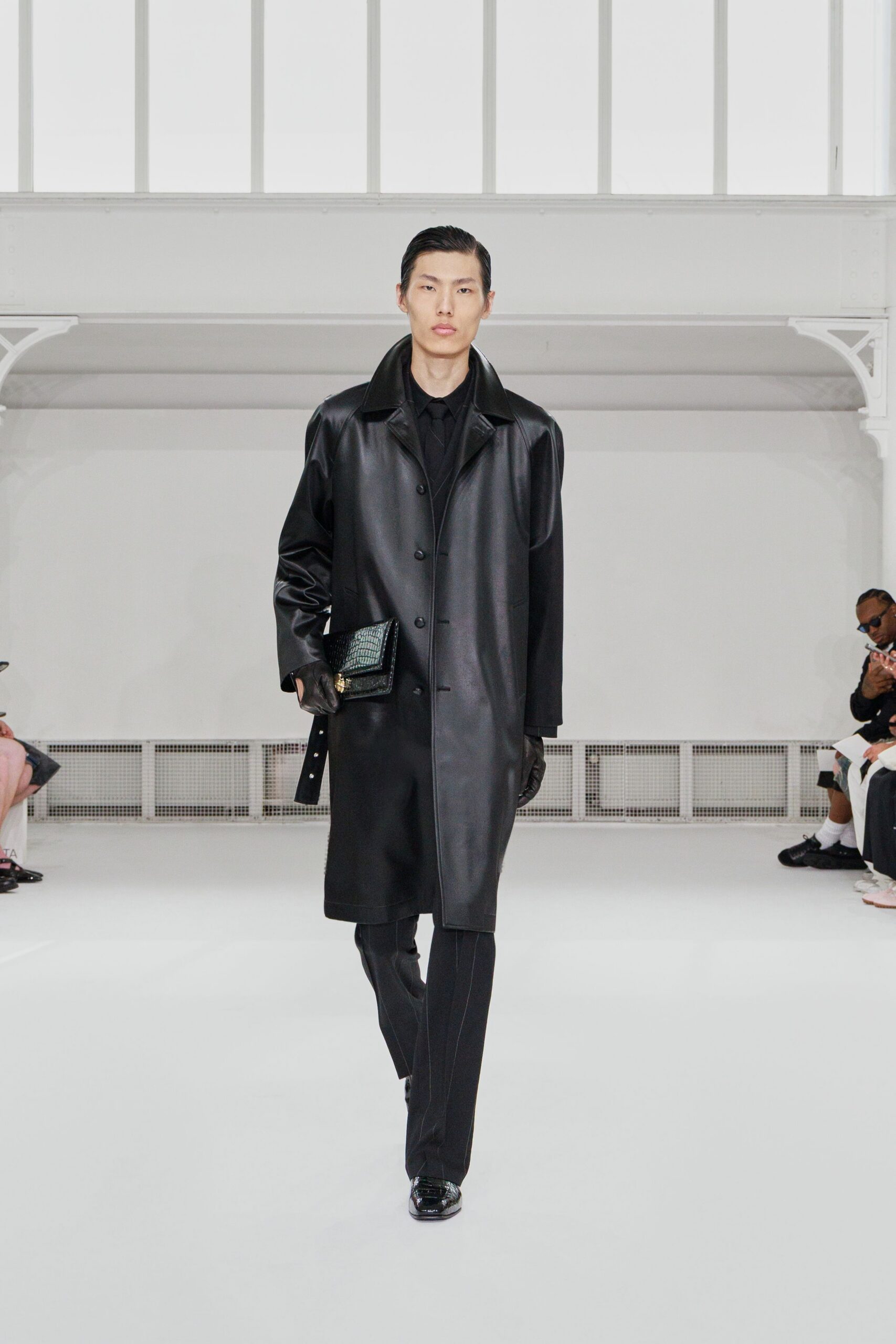 black leather coat and slim pants