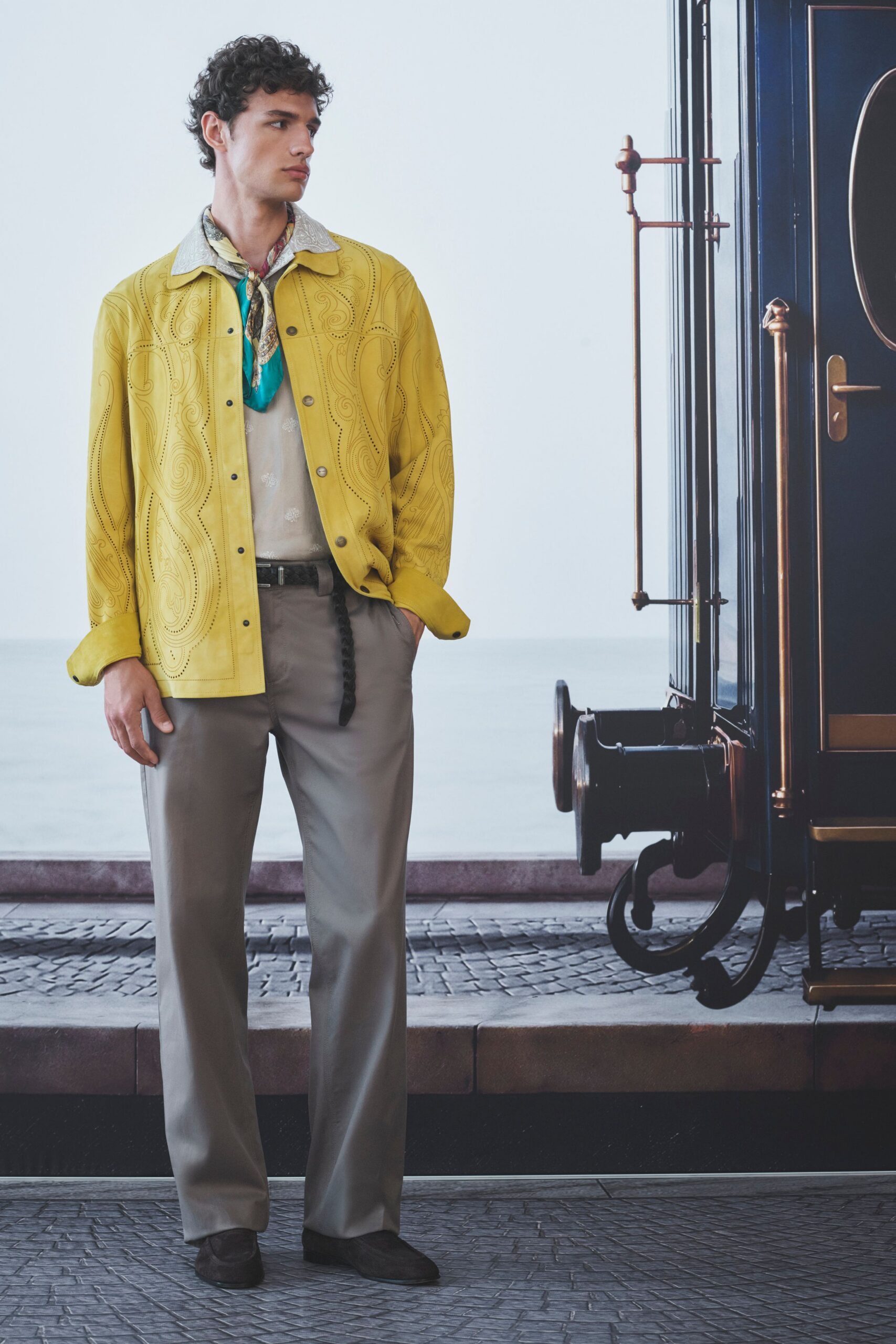 yellow embroidered jacket with gray pants
