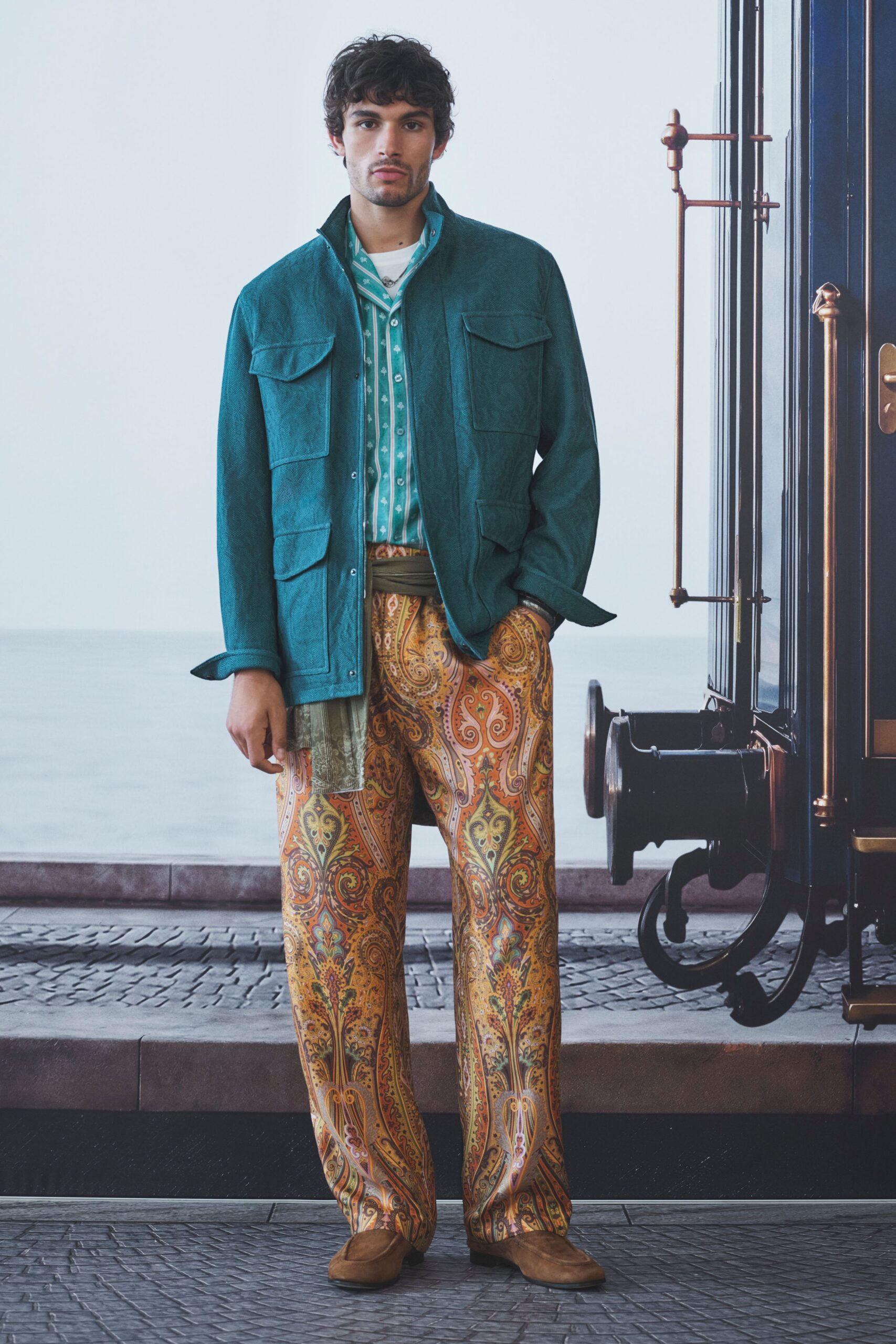 teal jacket with printed pants