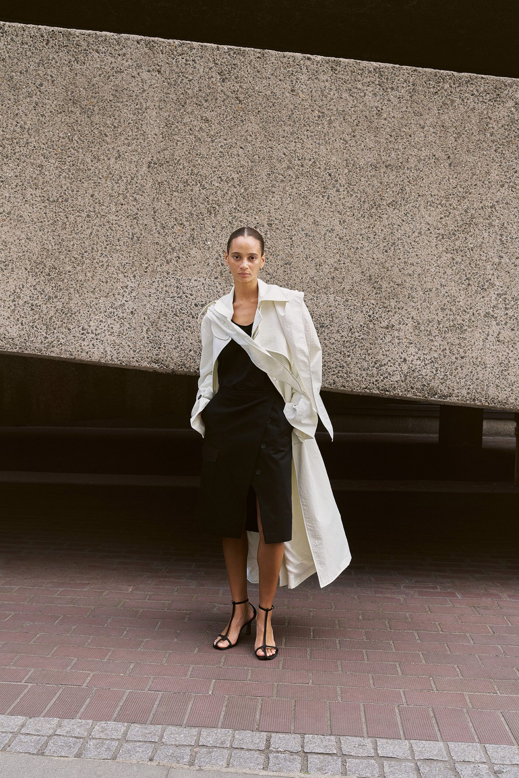 white cotton long-sleeve collared relaxed buttoned trench