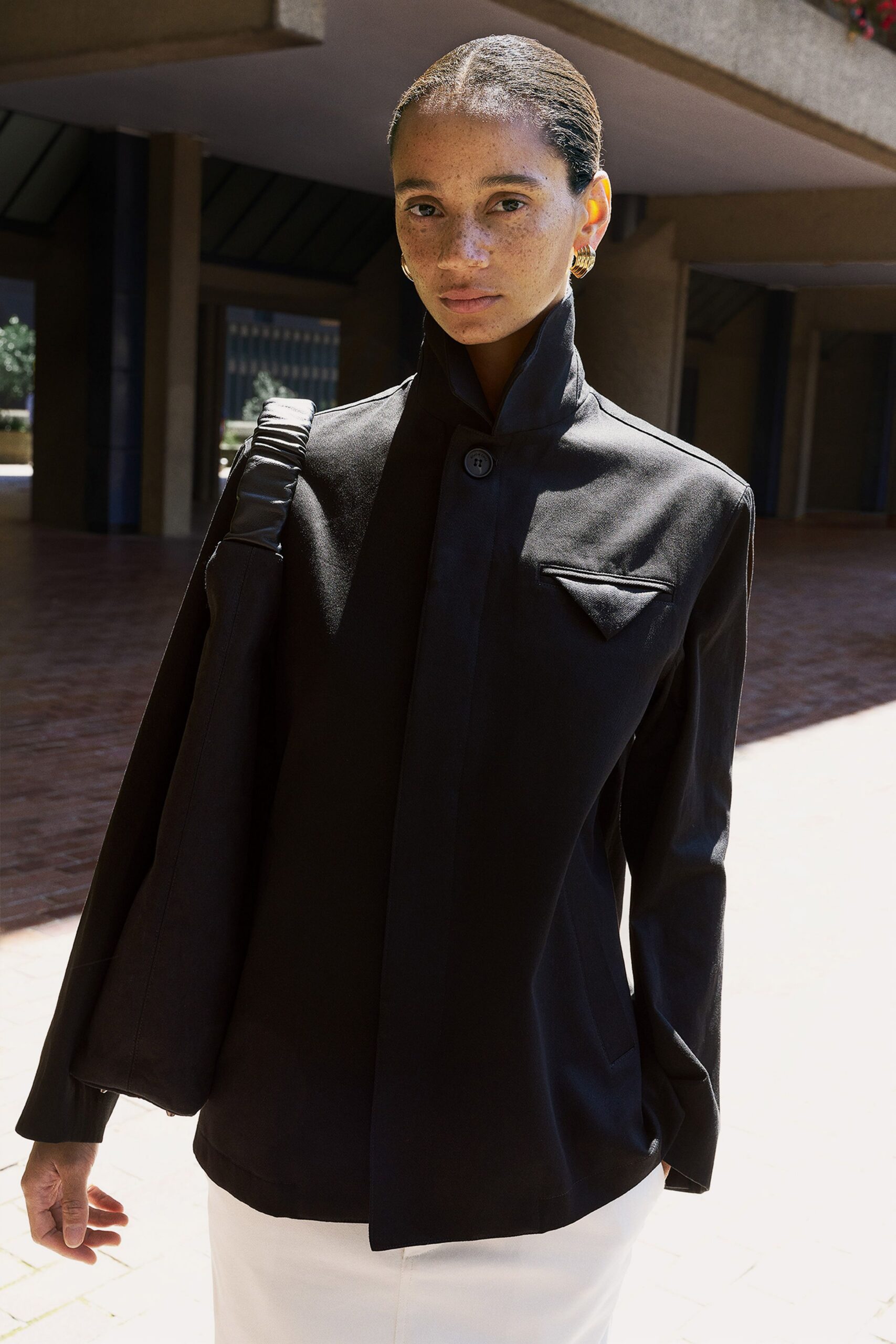 black cotton long-sleeve collared relaxed buttoned zippered jacket