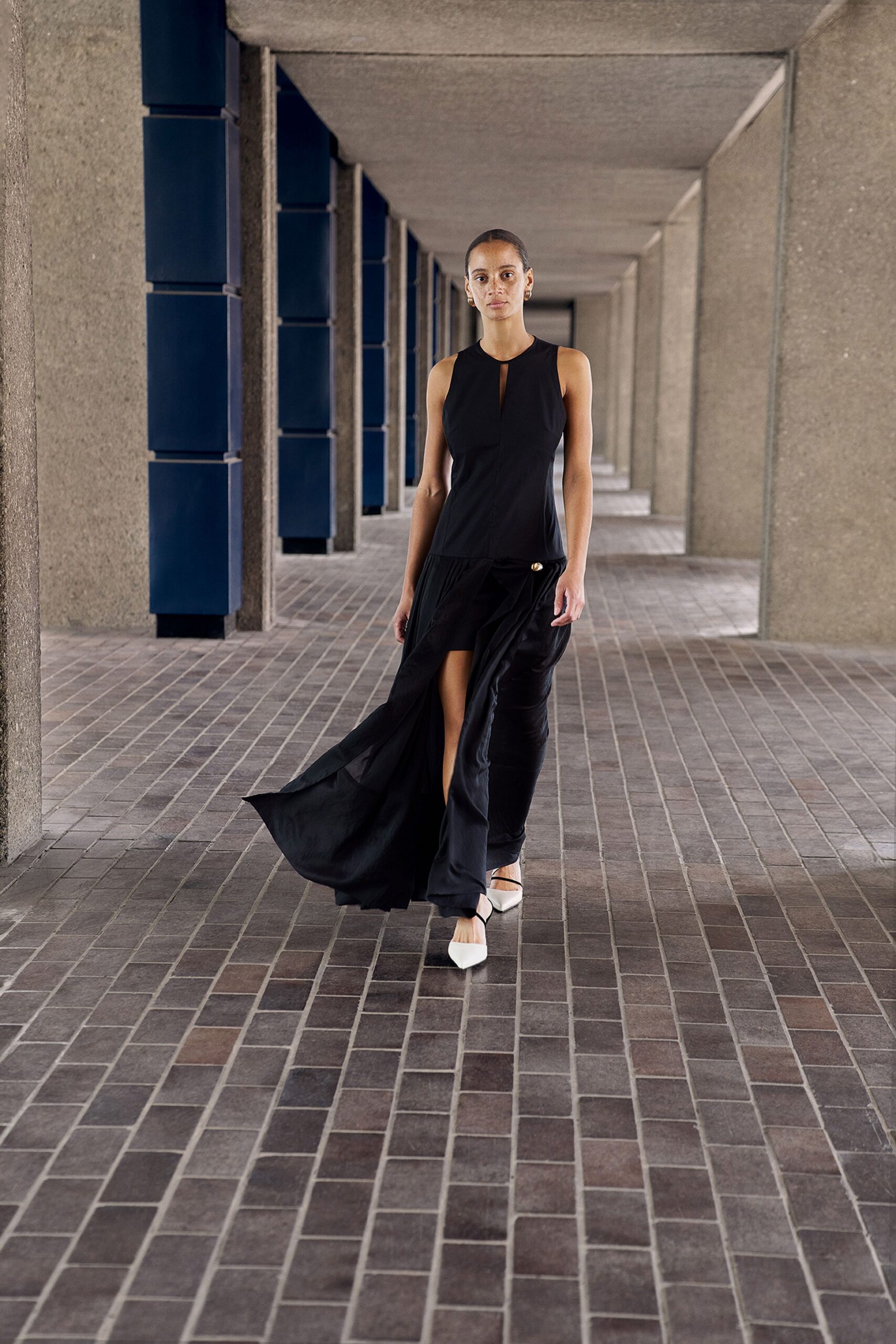 black silk sleeveless high-neck fitted flowing midi dress