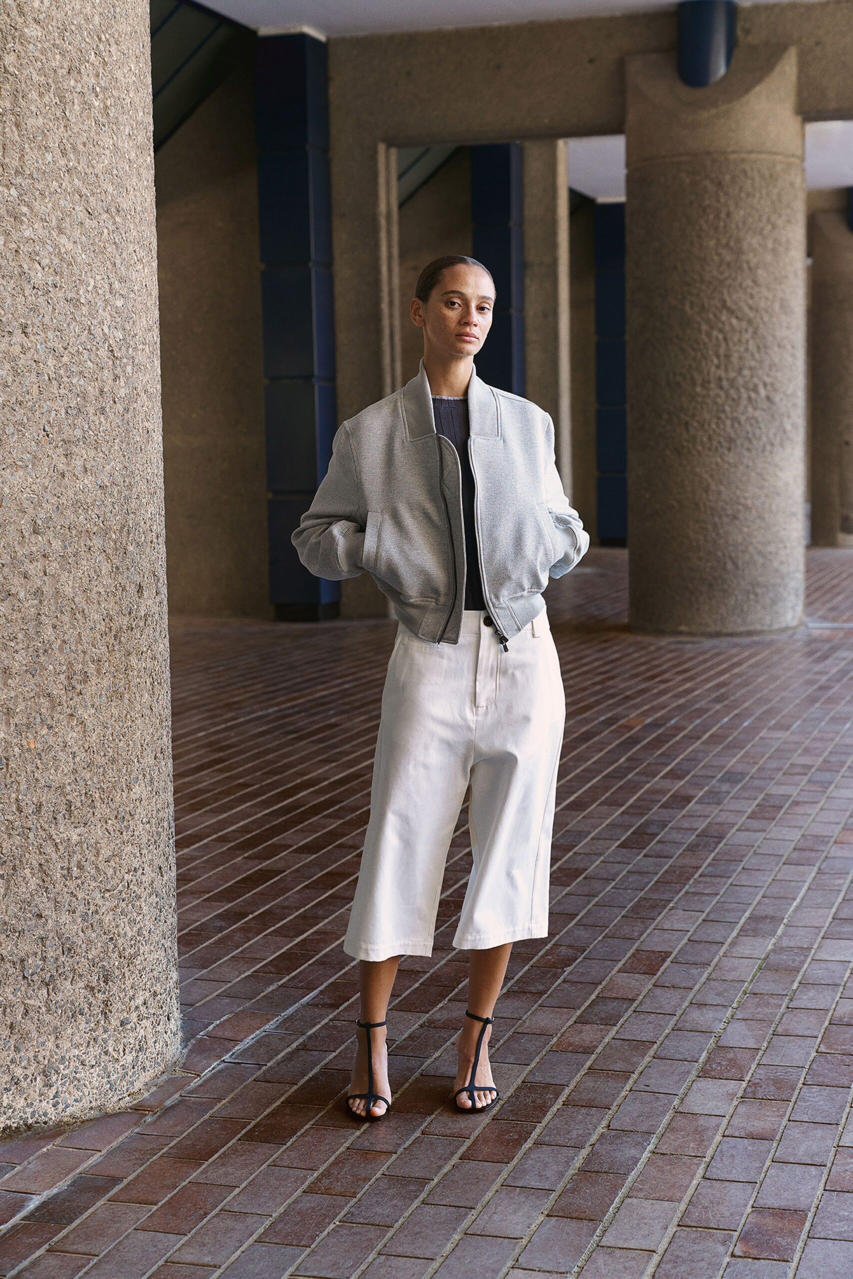 gray relaxed jacket white wide-leg pants