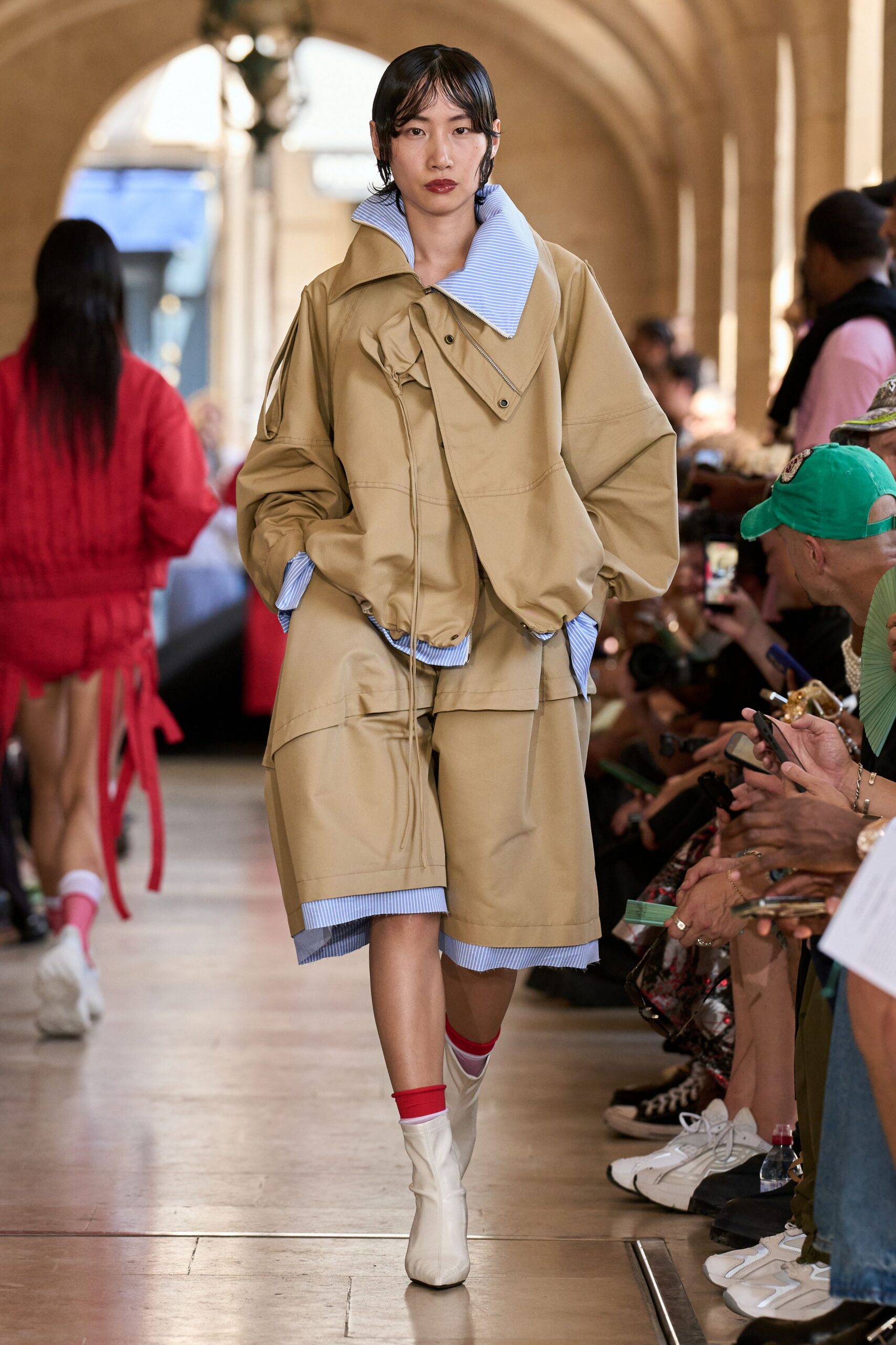 beige vinyl long-sleeve collared oversized zippered jacket