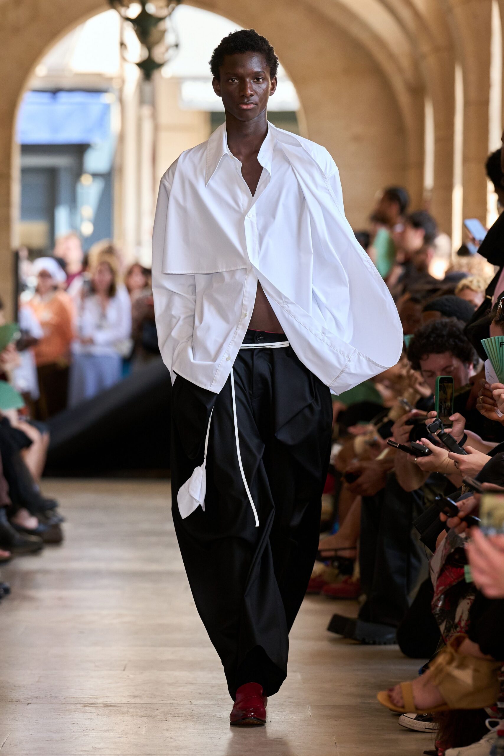 white cotton long-sleeve collared oversized buttoned shirt