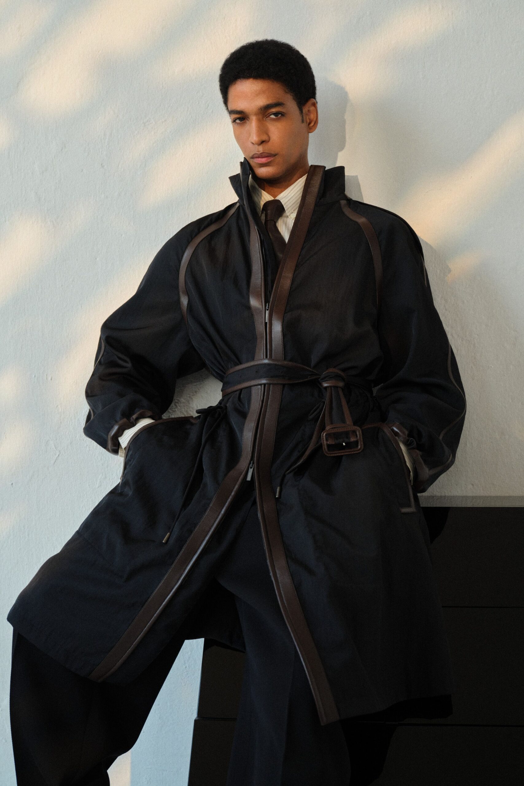 black cotton long-sleeve collared relaxed zippered belted coat