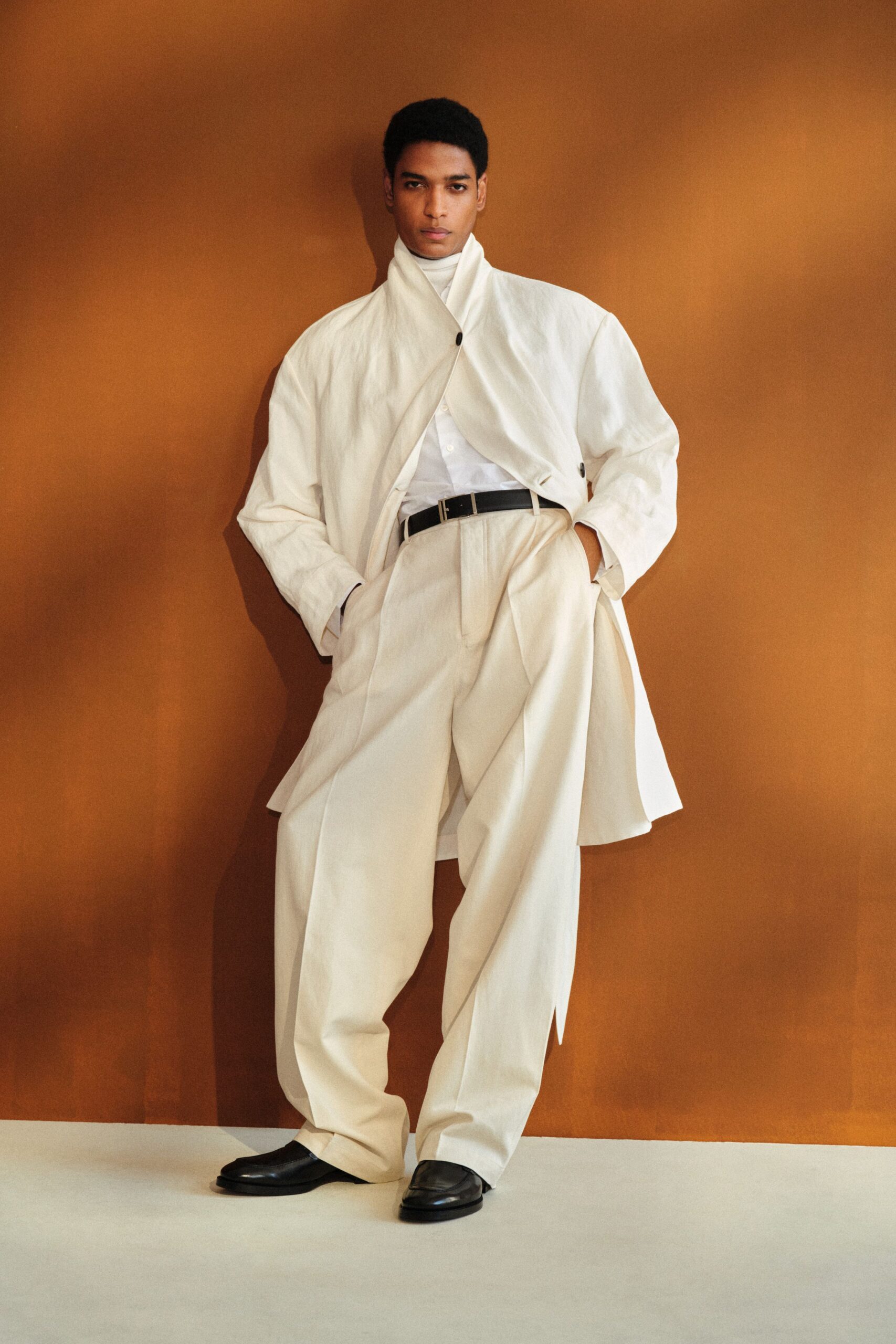 white cotton long-sleeve collared relaxed buttoned jacket
