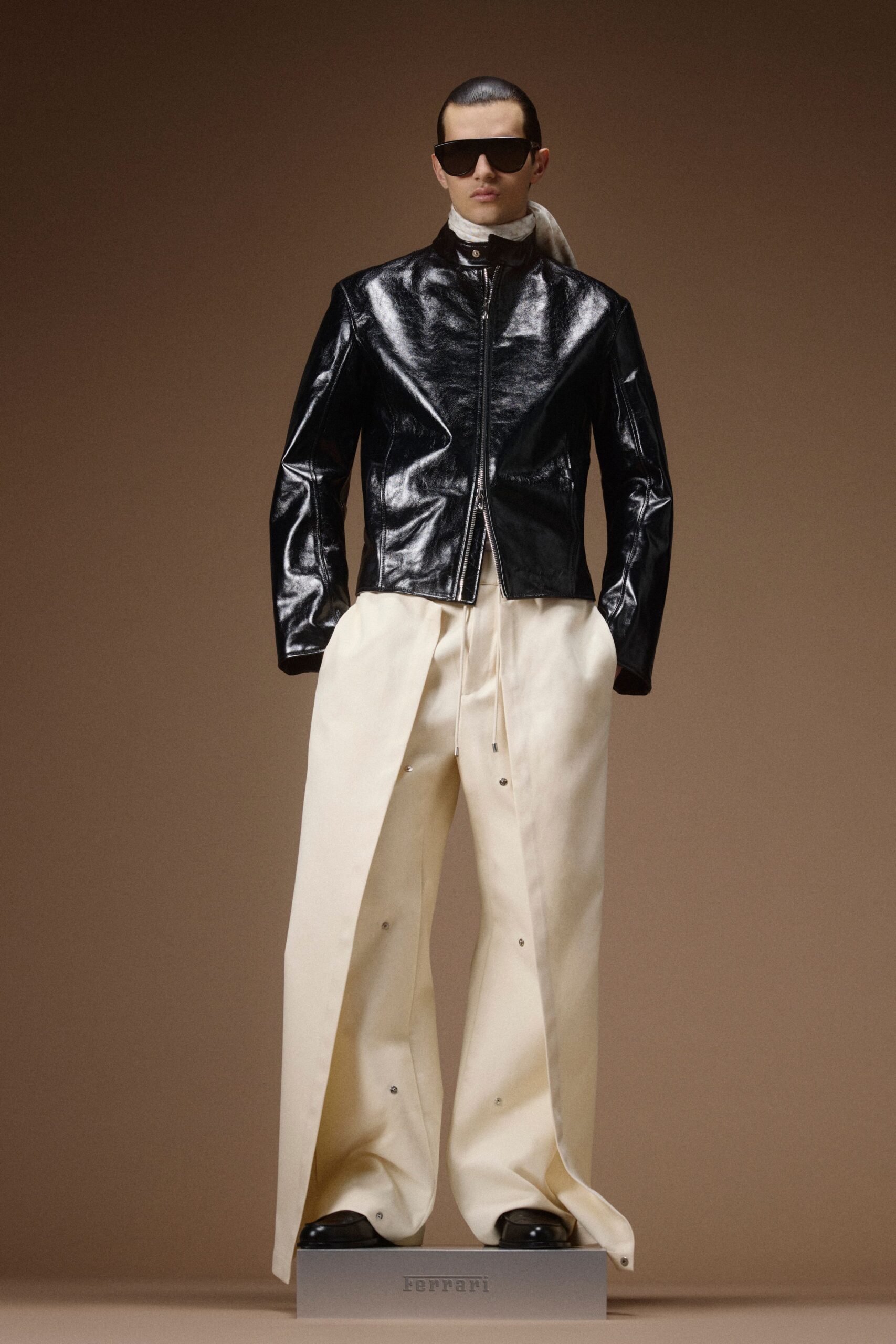 black leather long-sleeve collared fitted zippered shiny jacket