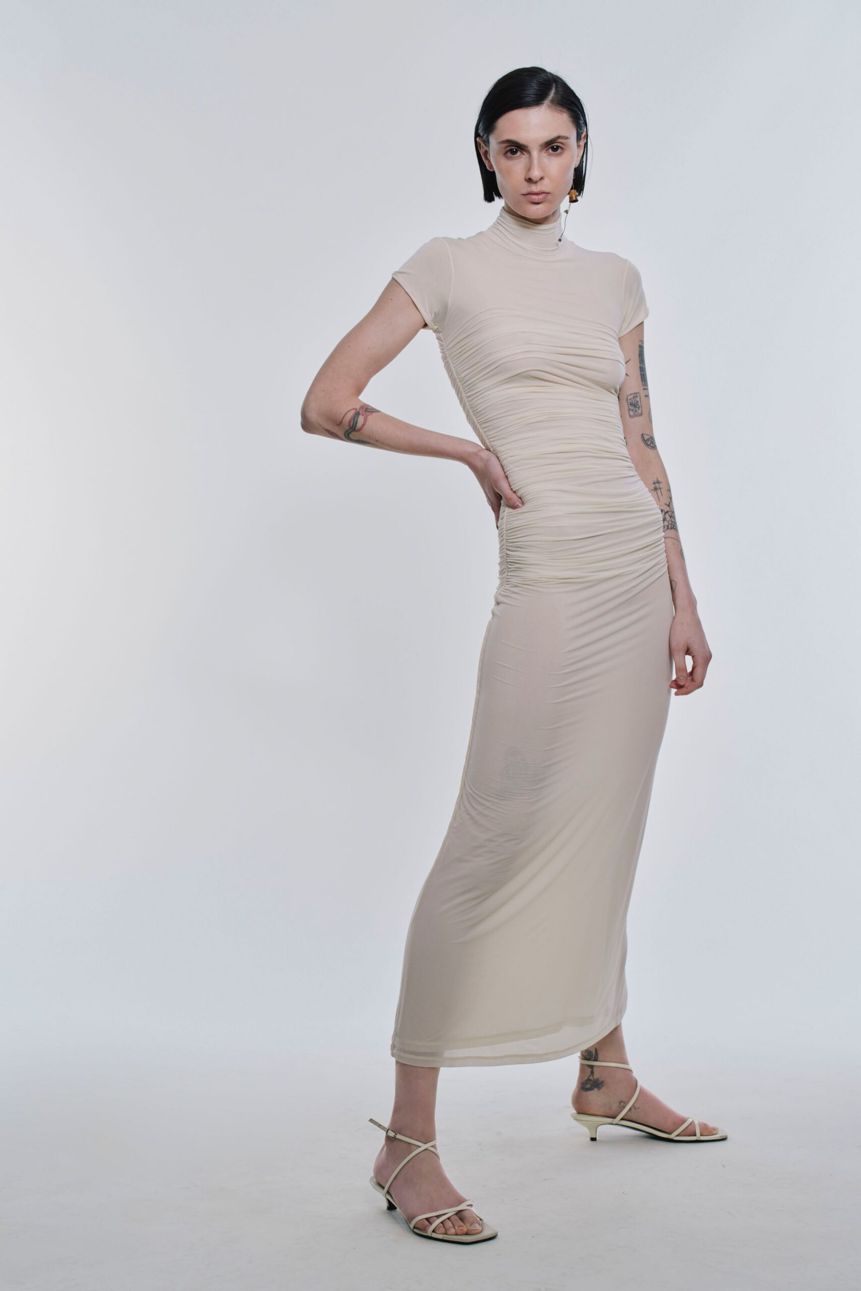 beige silk short-sleeve high-neck fitted ruched sheer dress