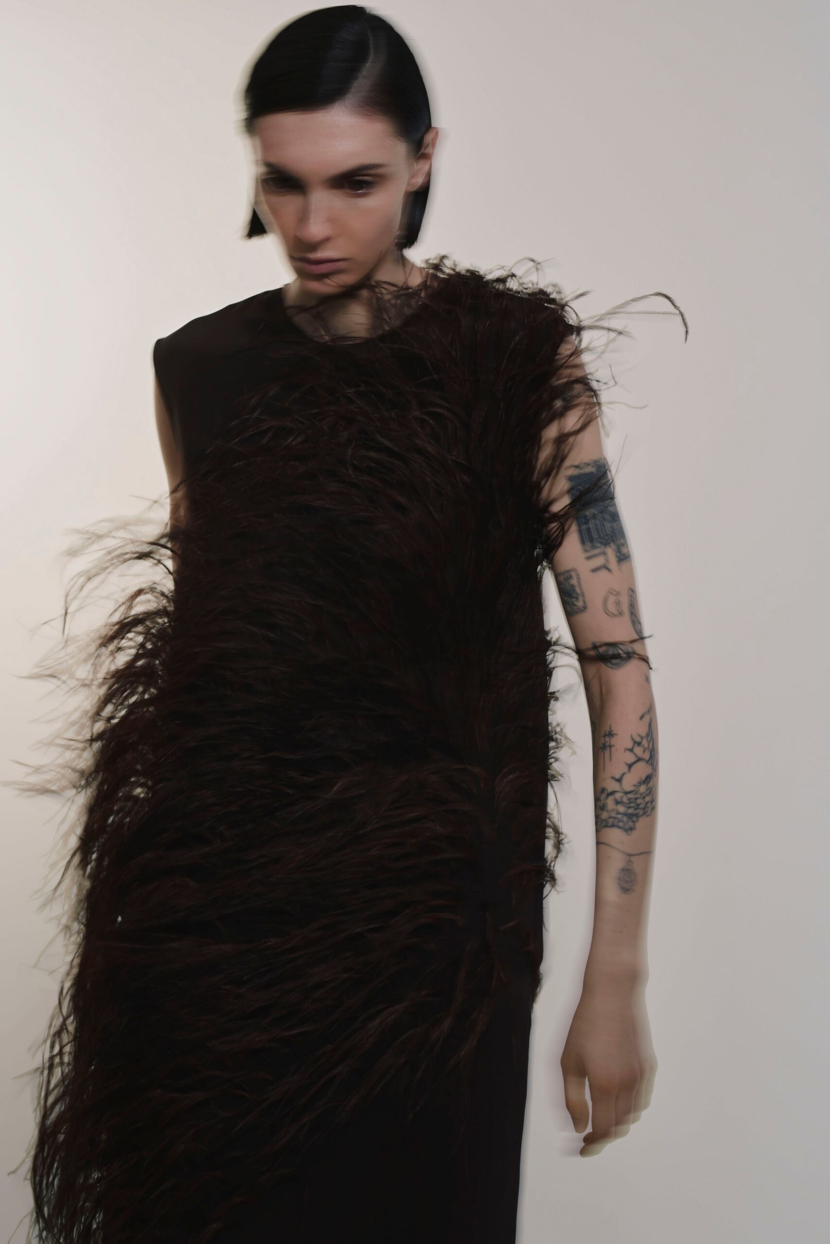 black dress with fringed detail