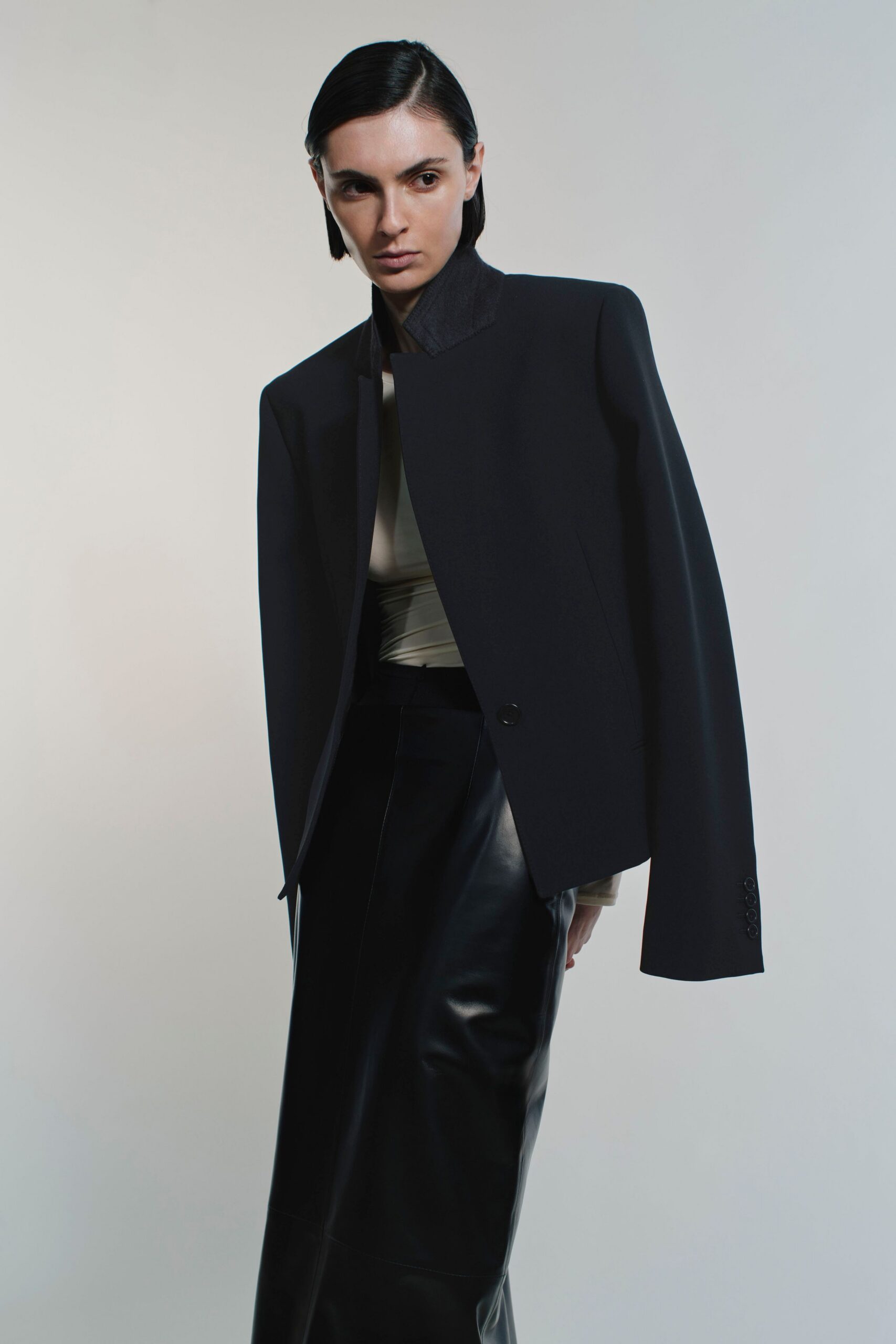 black wool long-sleeve collared structured buttoned jacket