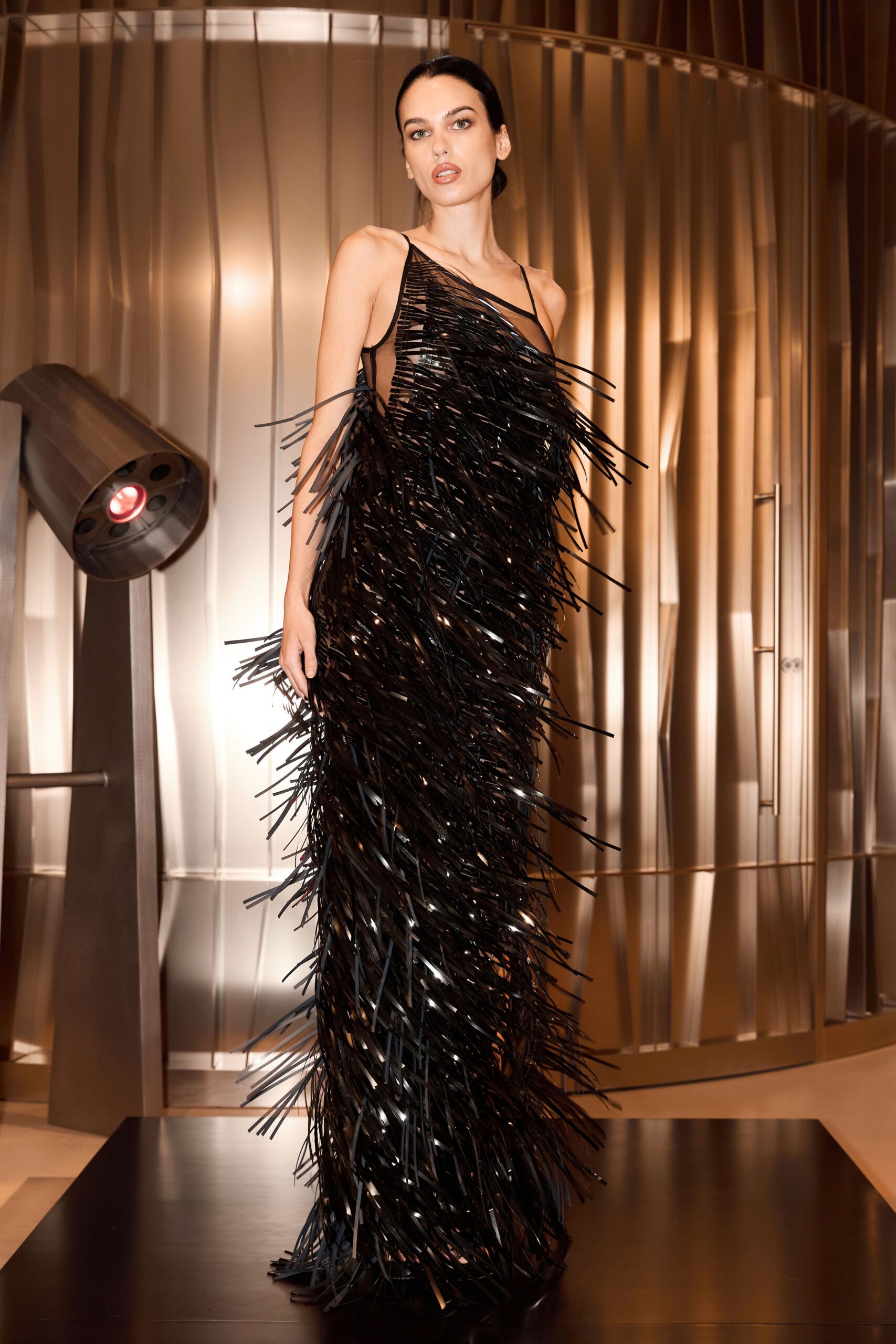black fringed vinyl gown