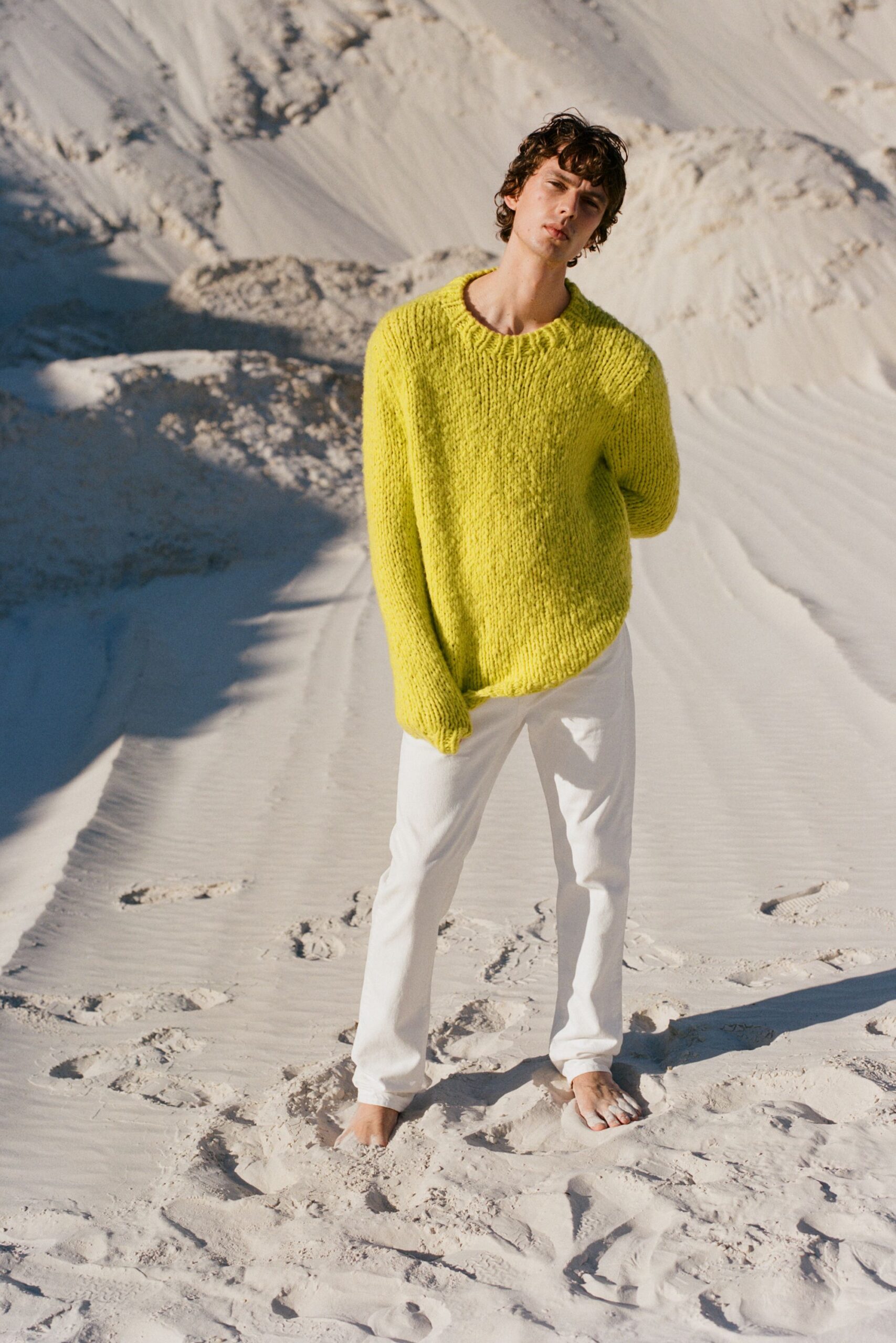 oversized yellow sweater and white pants