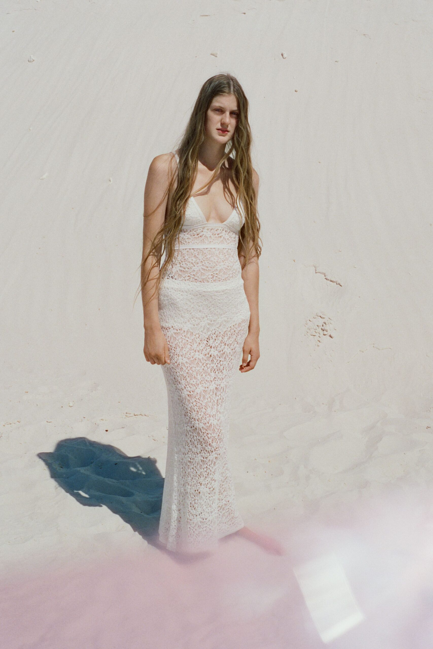 white lace sleeveless gown