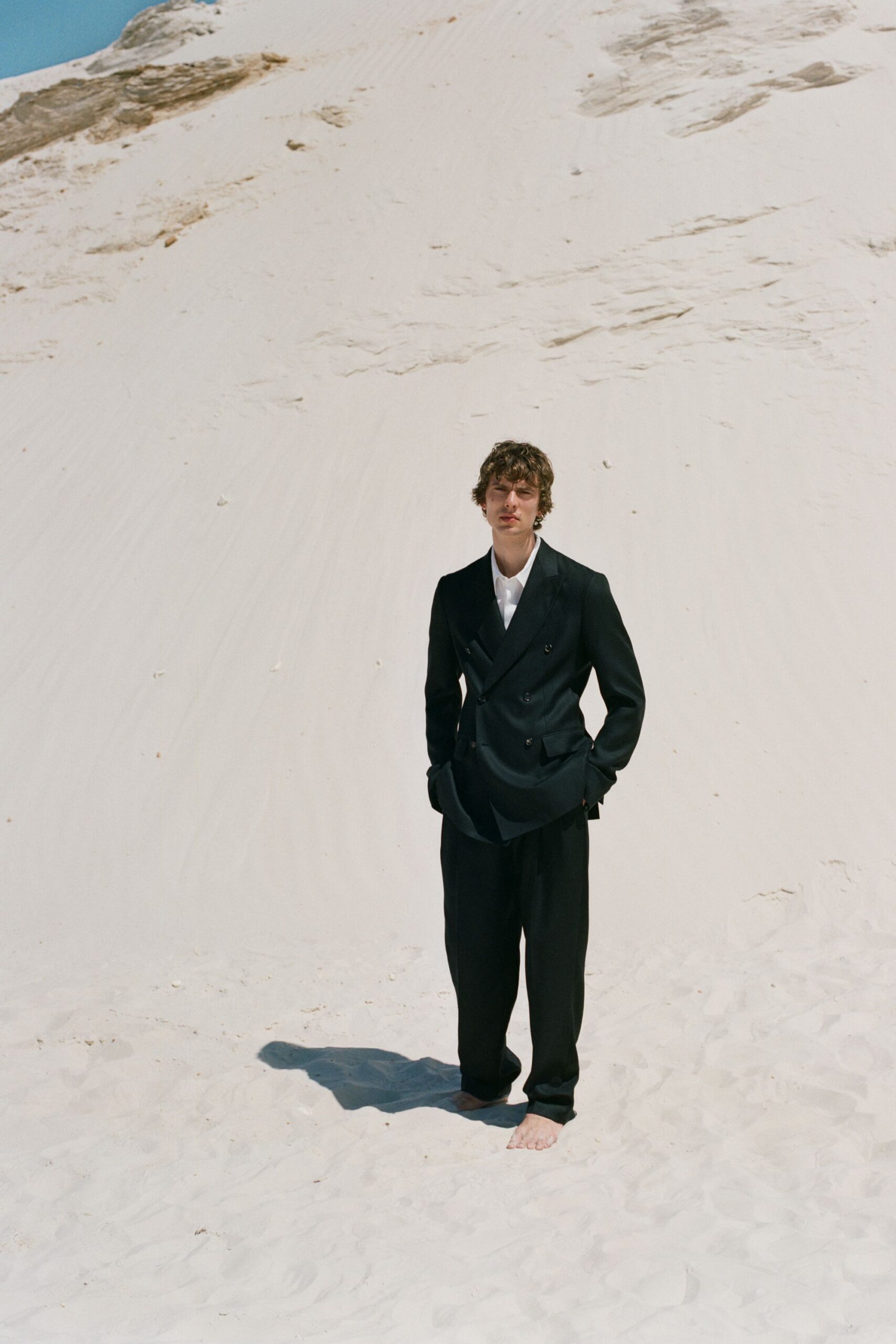 black long-sleeve collared tailored suit