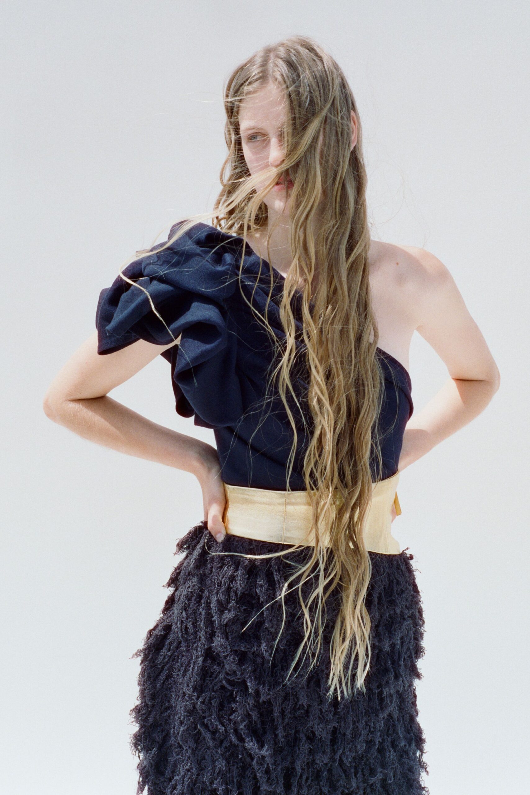 navy ruffled midi dress with gold belt