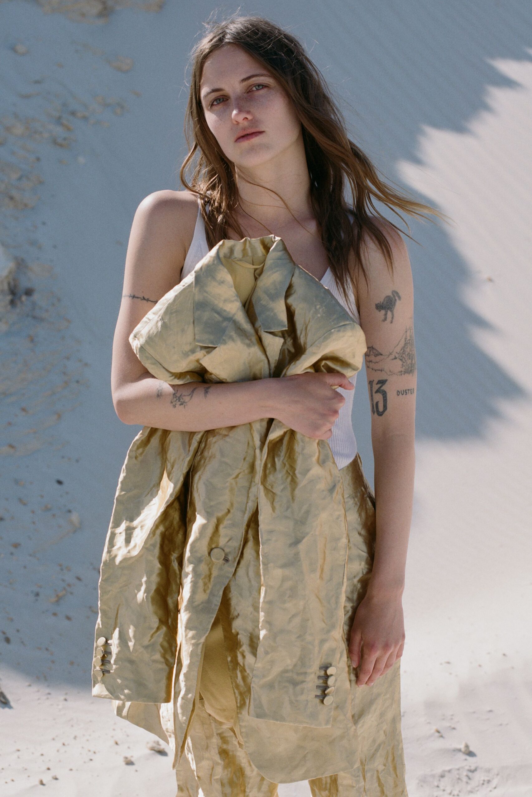 white fitted top and gold coat