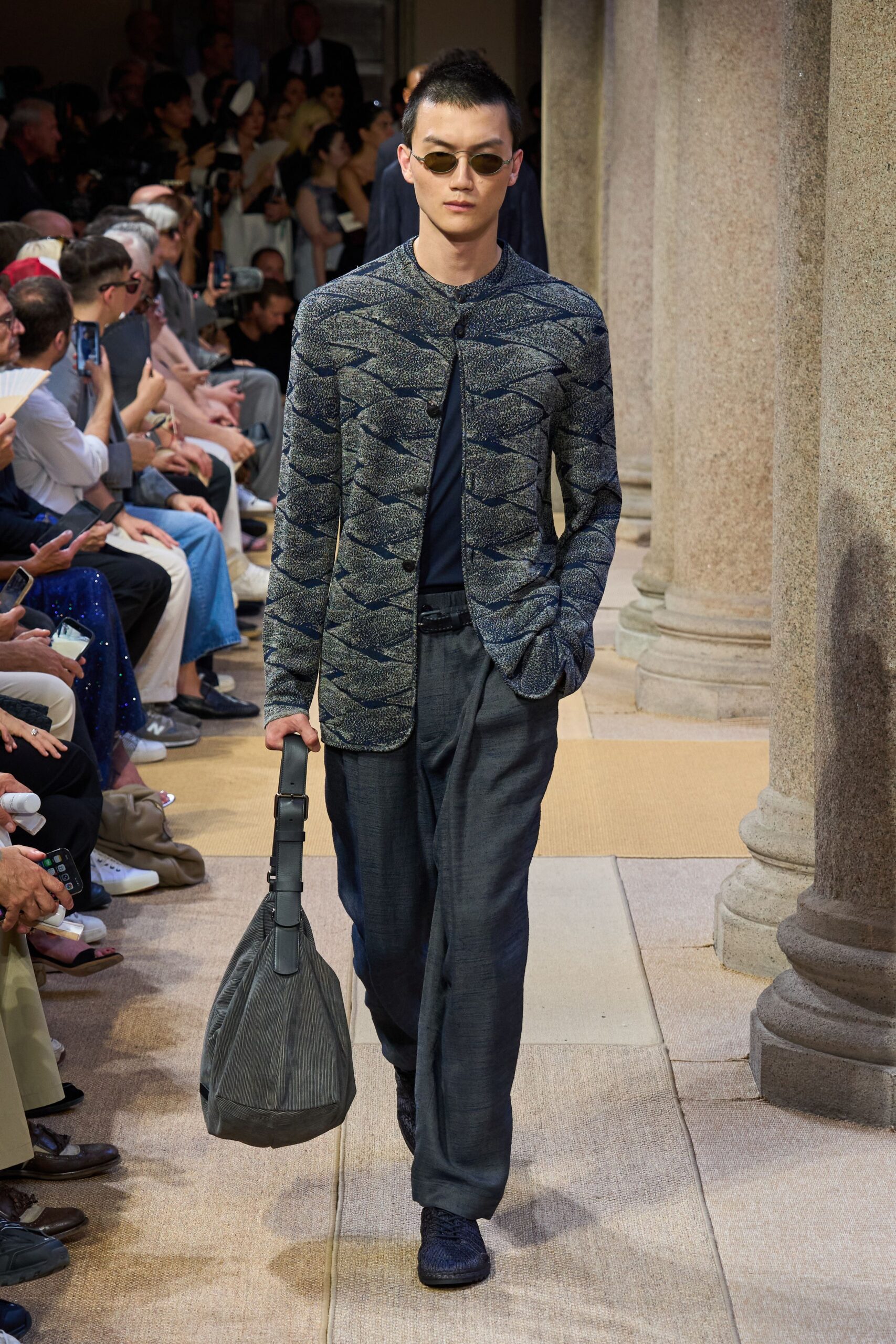 blue textured jacket with gray pants