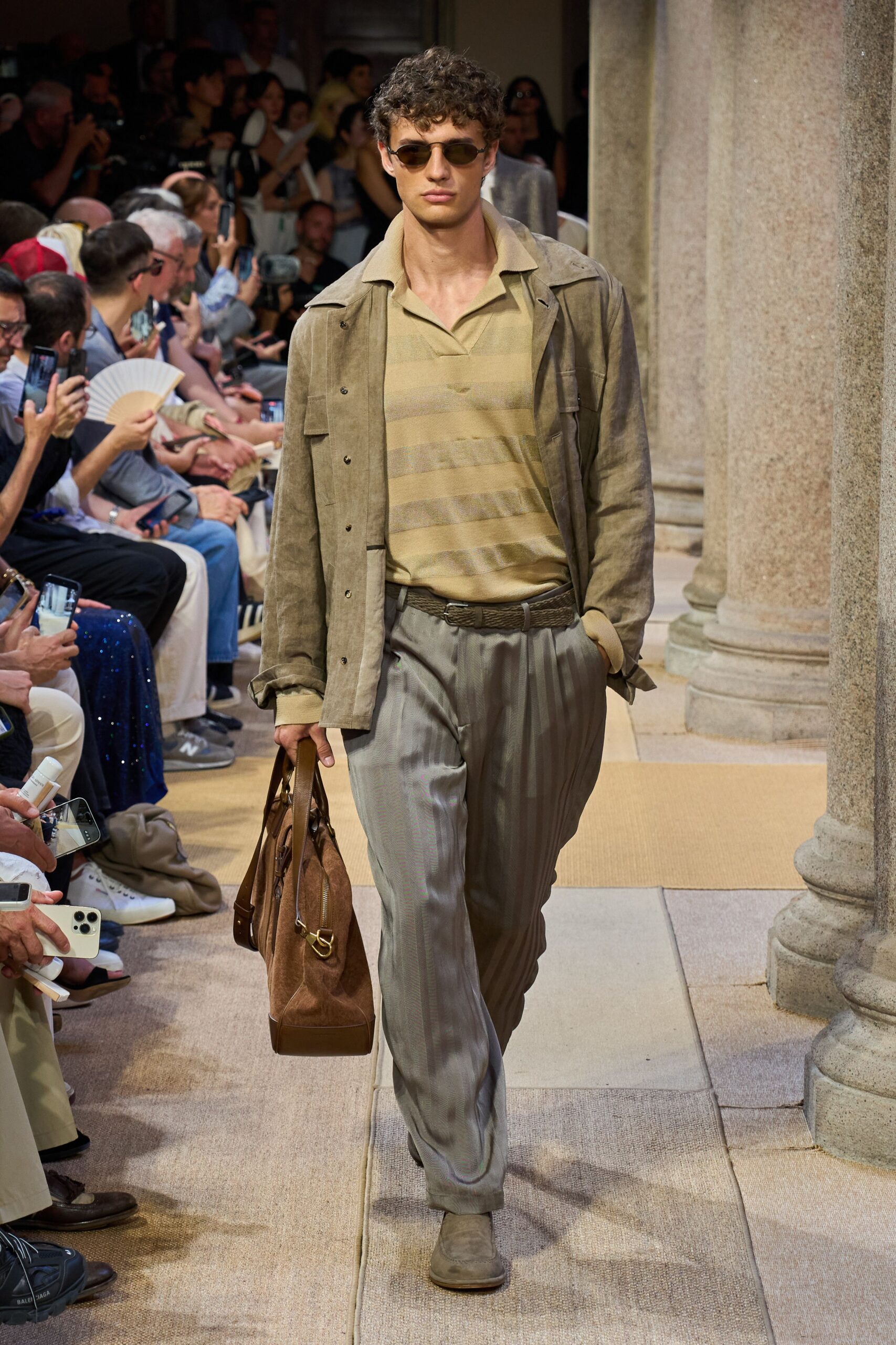 beige jacket yellow shirt gray pants
