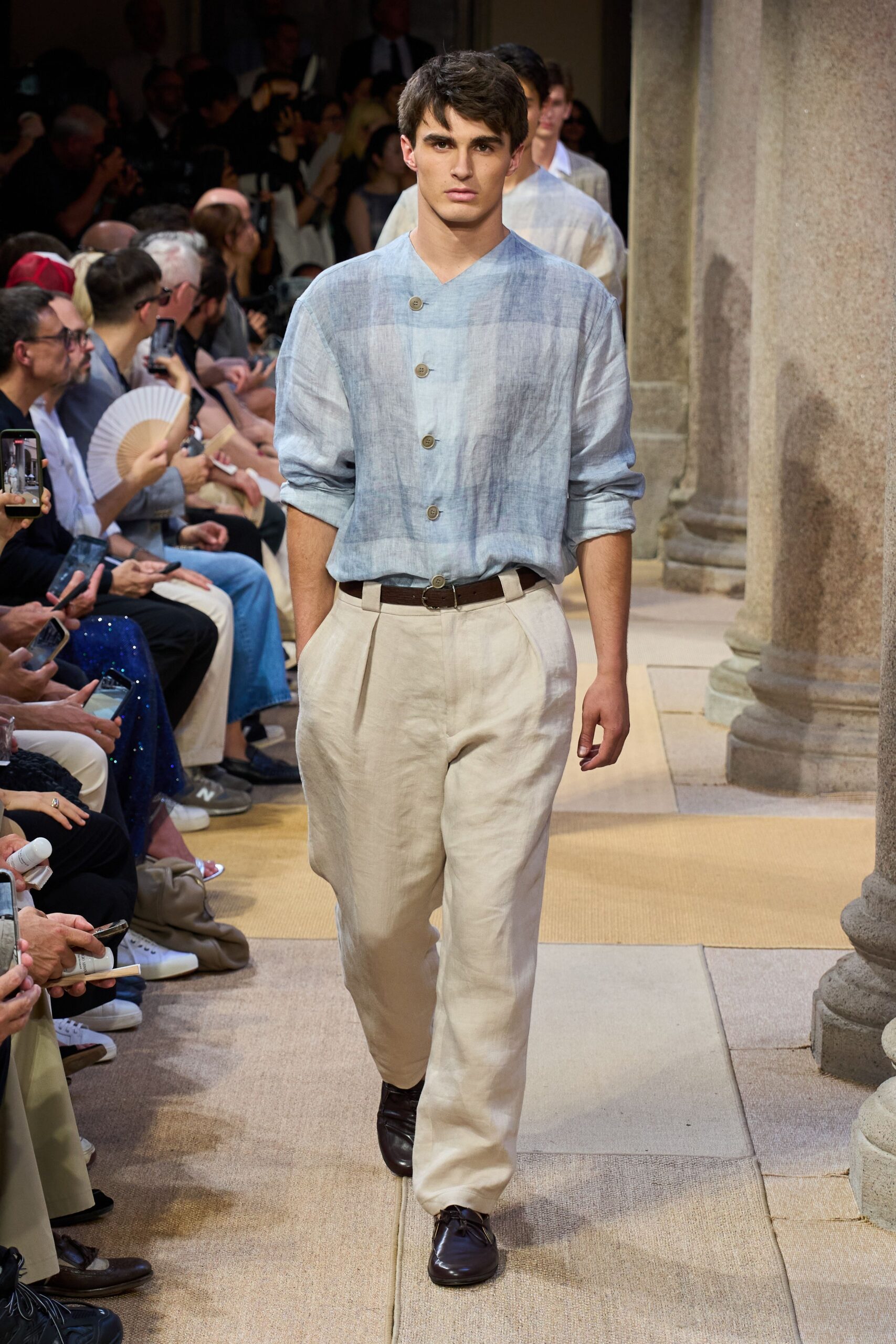 blue and white relaxed shirt with beige pants