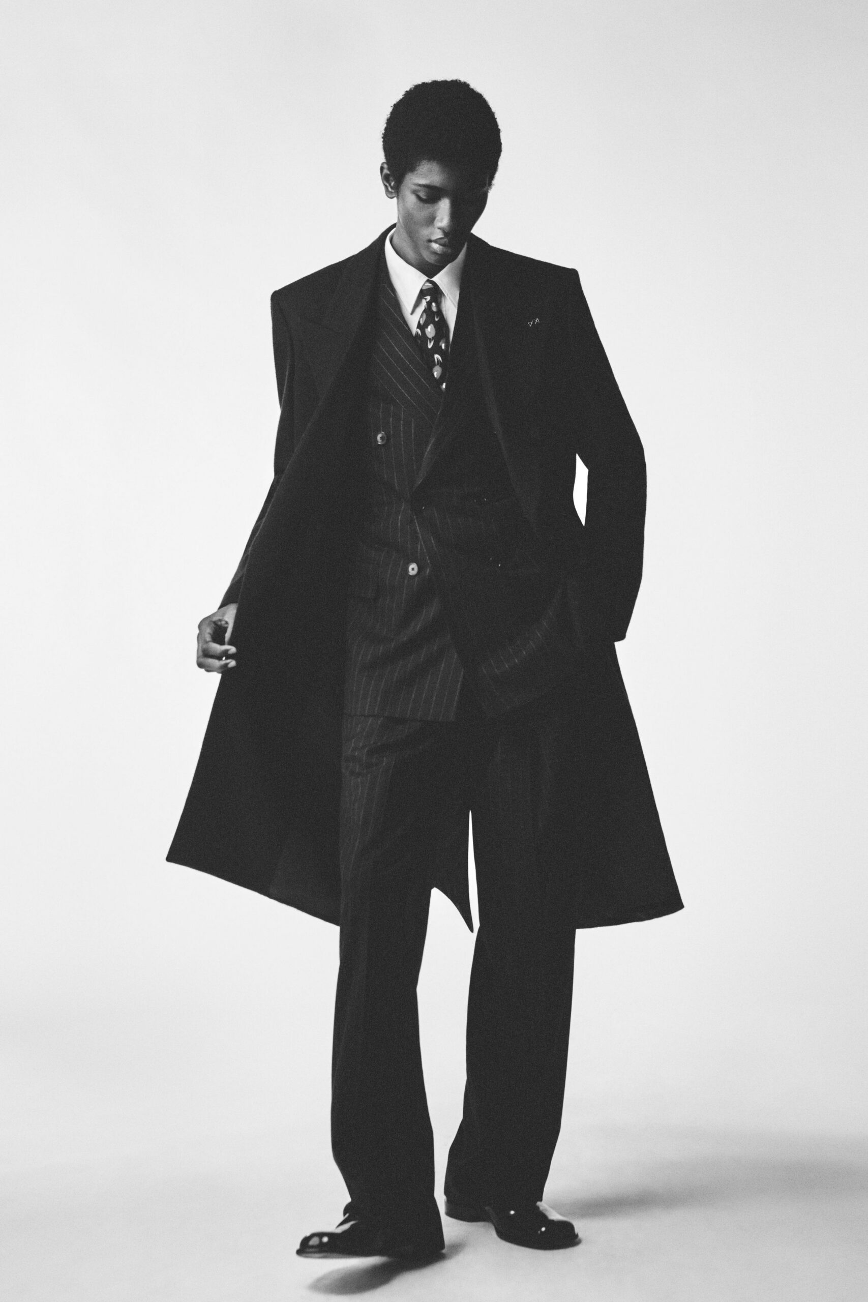 black wool long-sleeve collared tailored striped buttoned suit