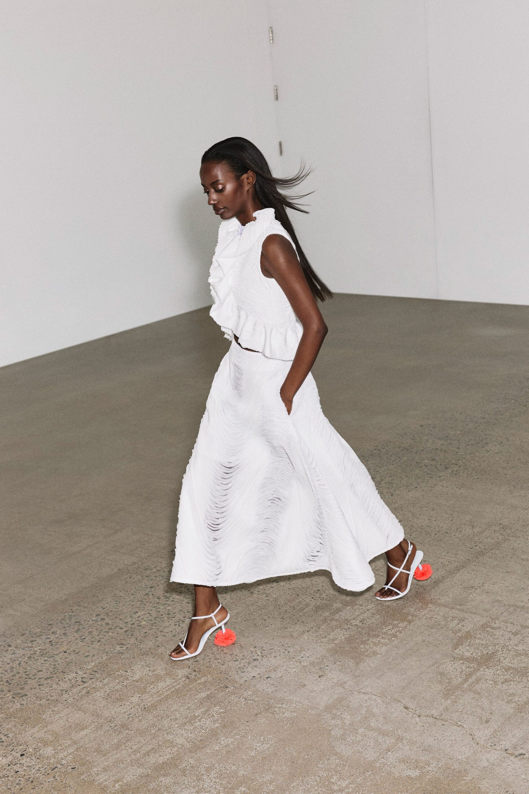 white cotton sleeveless high-neck fitted ruffled tiered dress