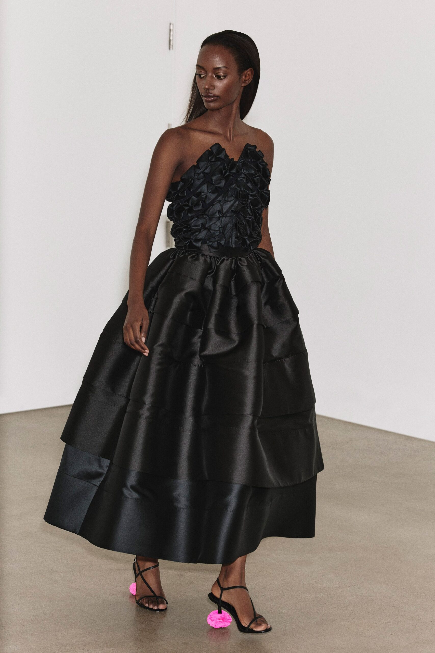 black silk strapless fitted ruffled tiered shiny gown