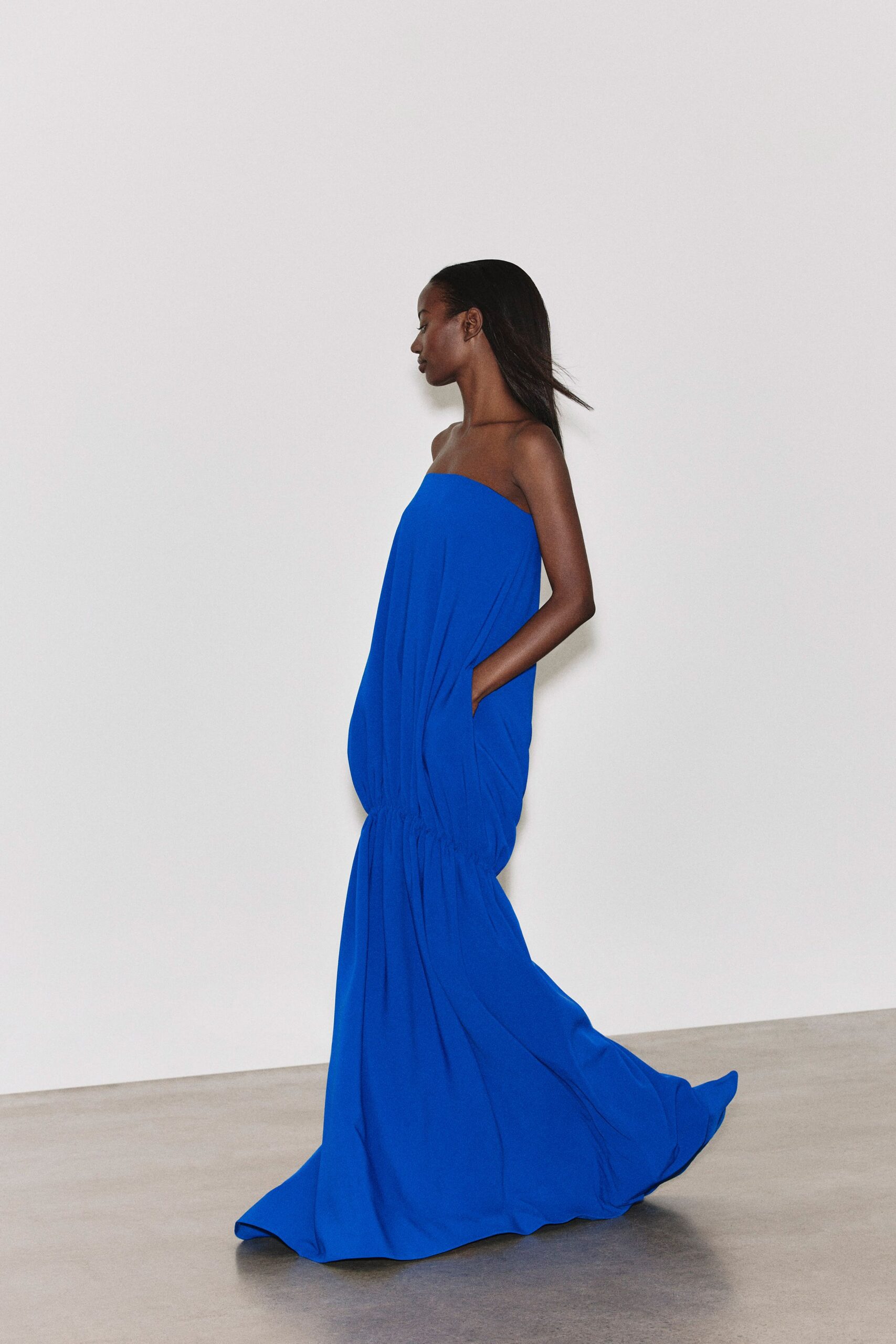 blue strapless flowing gown