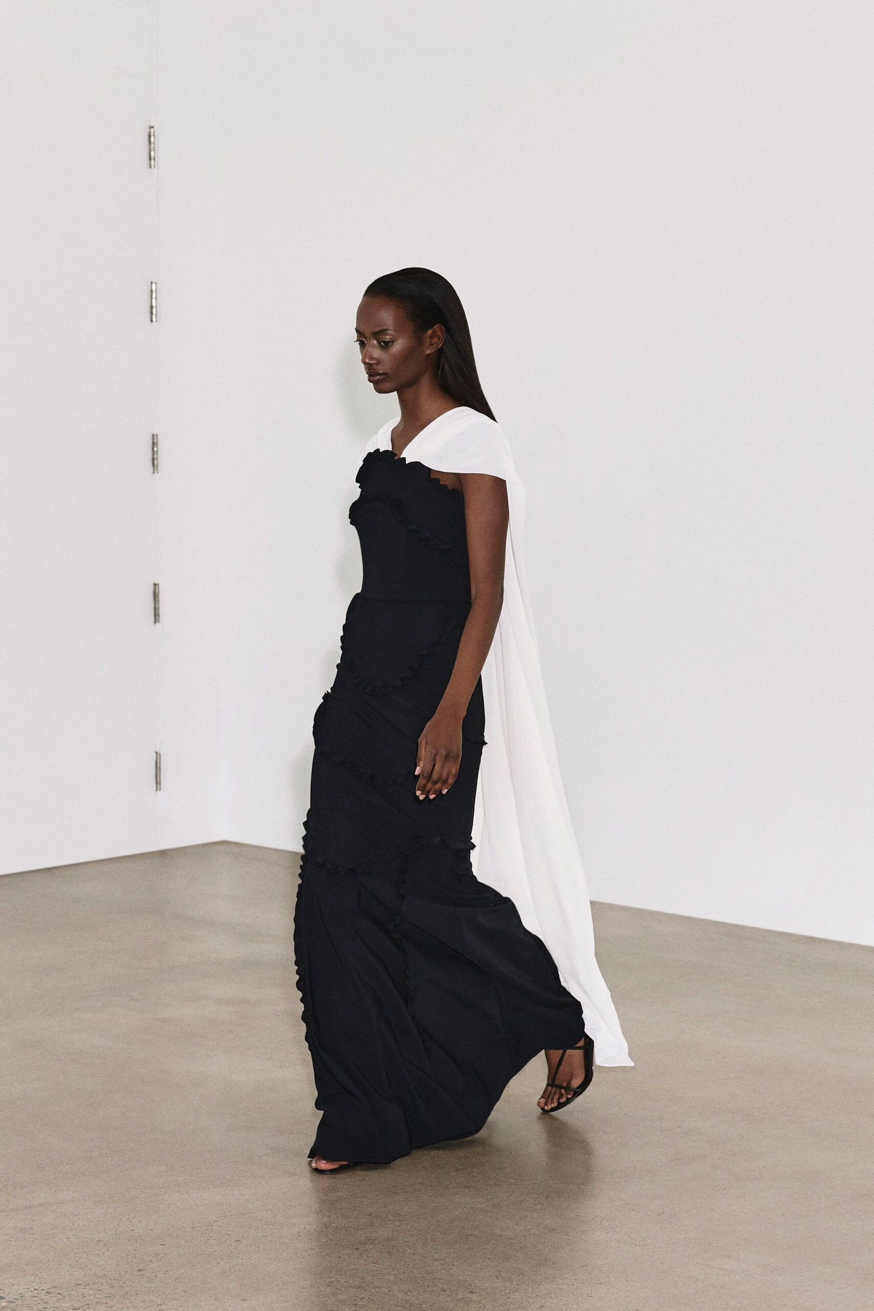 black cotton sleeveless off-shoulder fitted ruffled layered gown