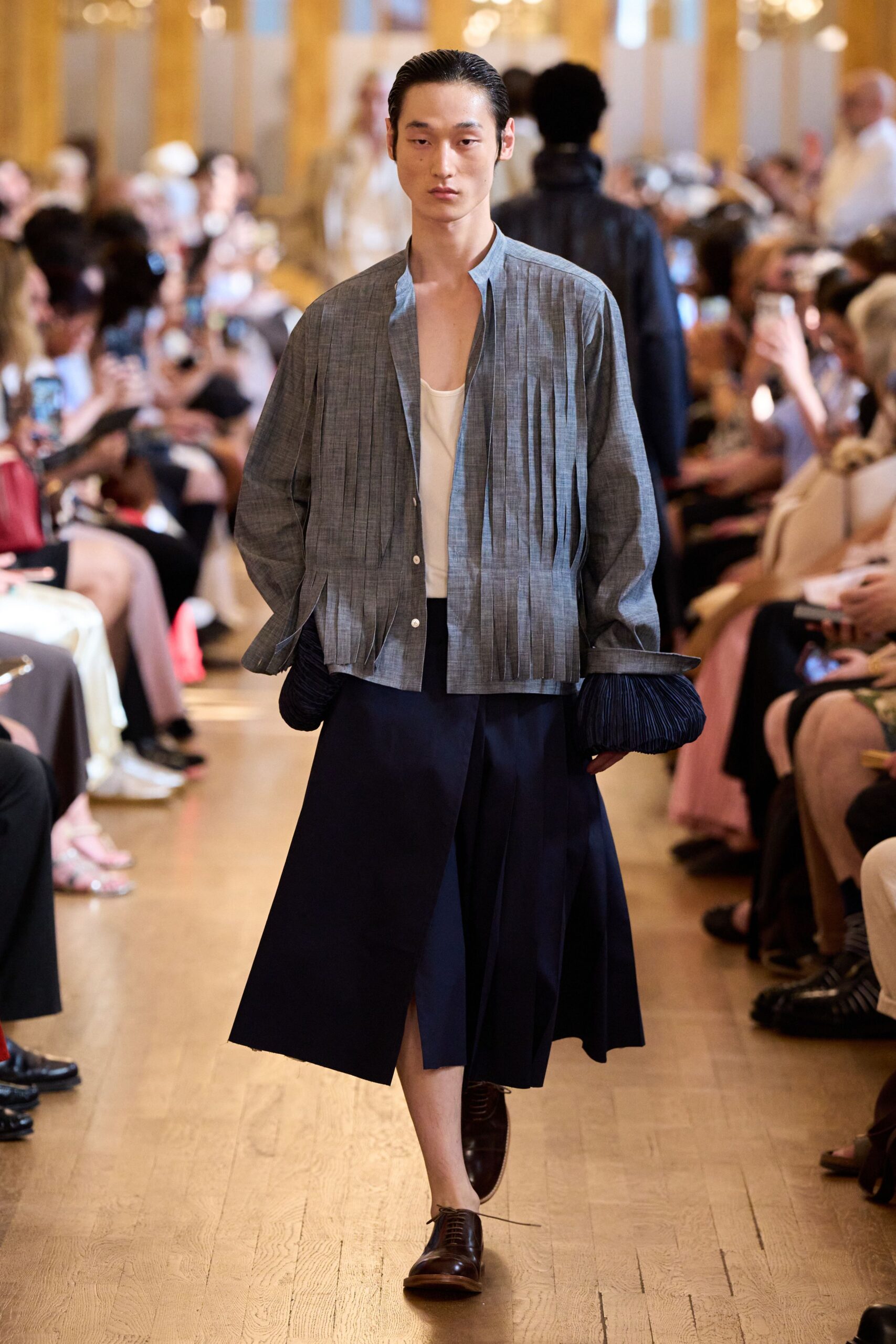 blue pleated jacket with white top
