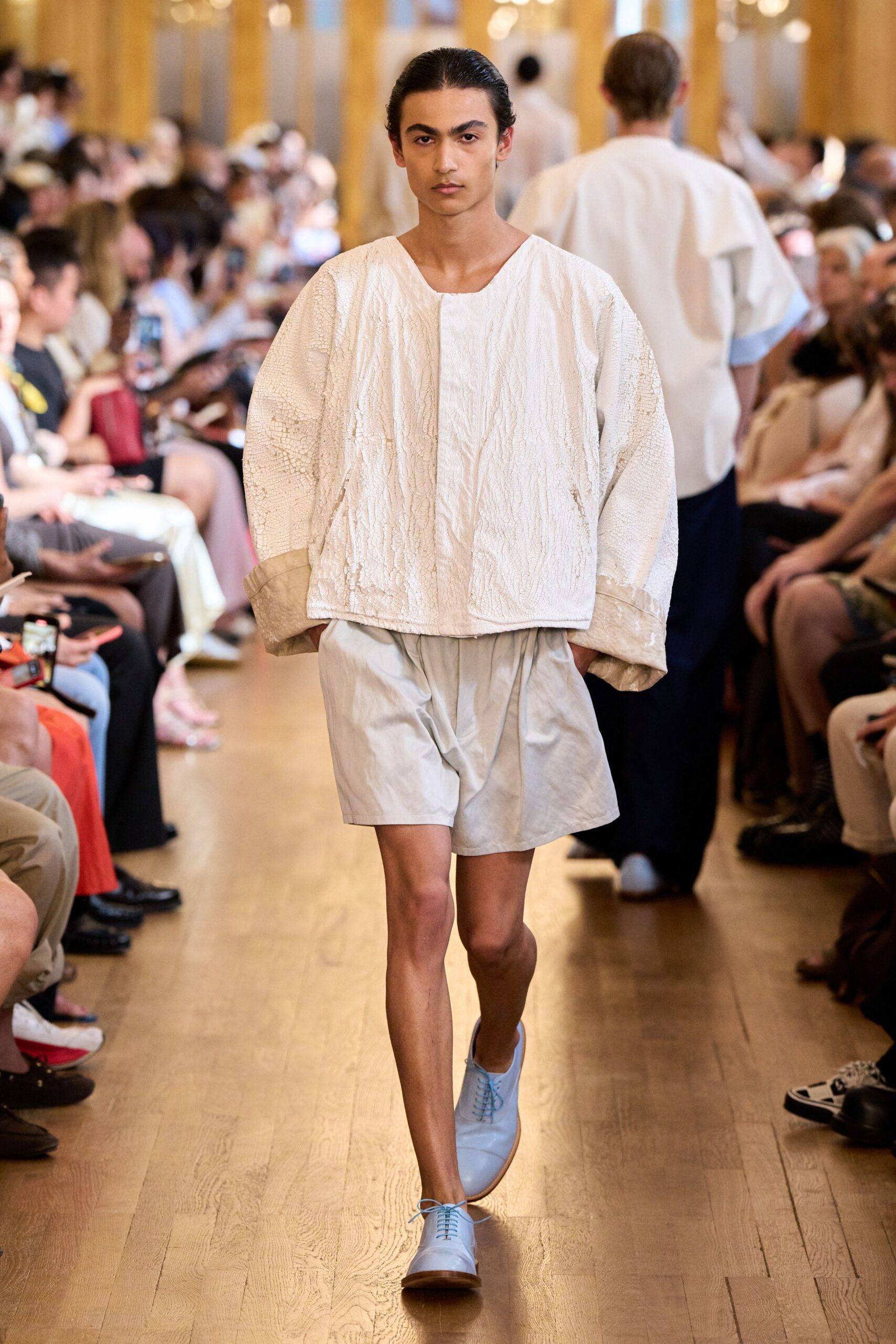 white embroidered top with light blue shorts