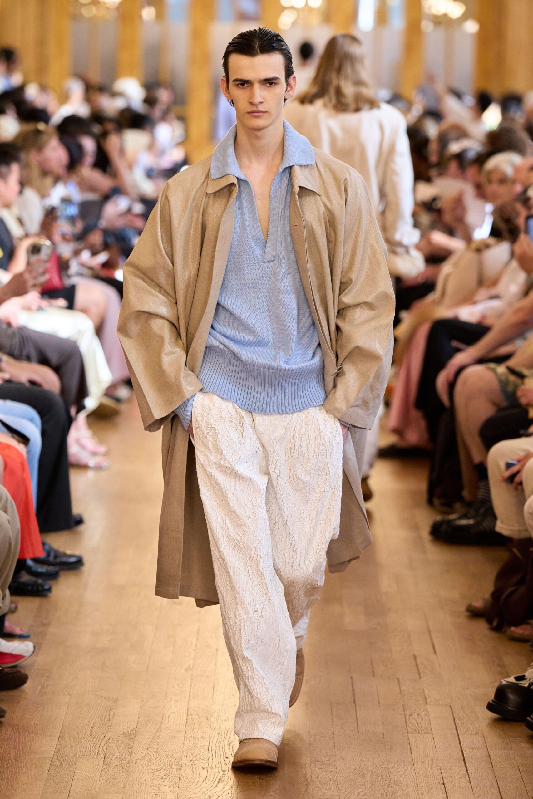 beige coat blue shirt white pants