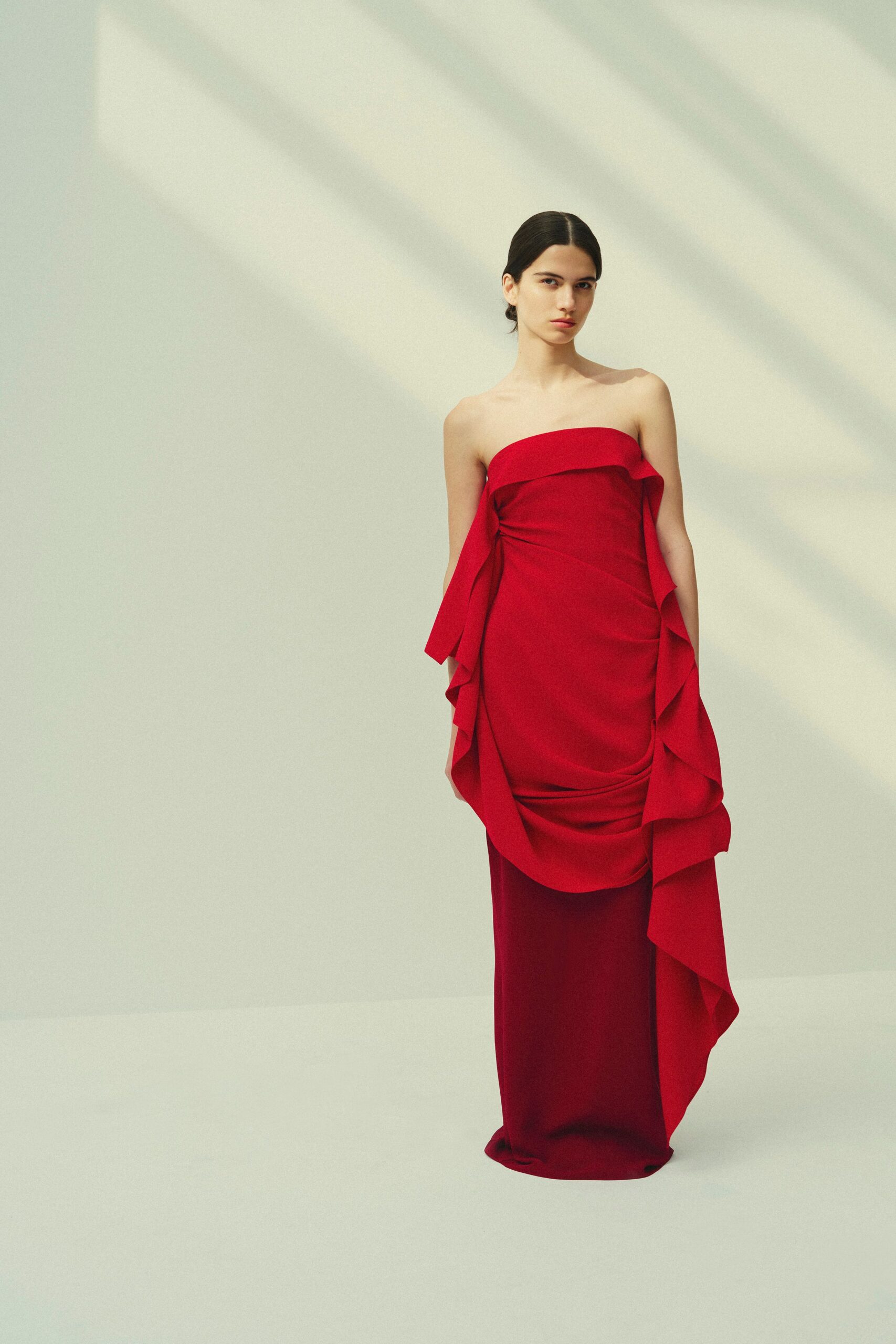 red strapless draped gown