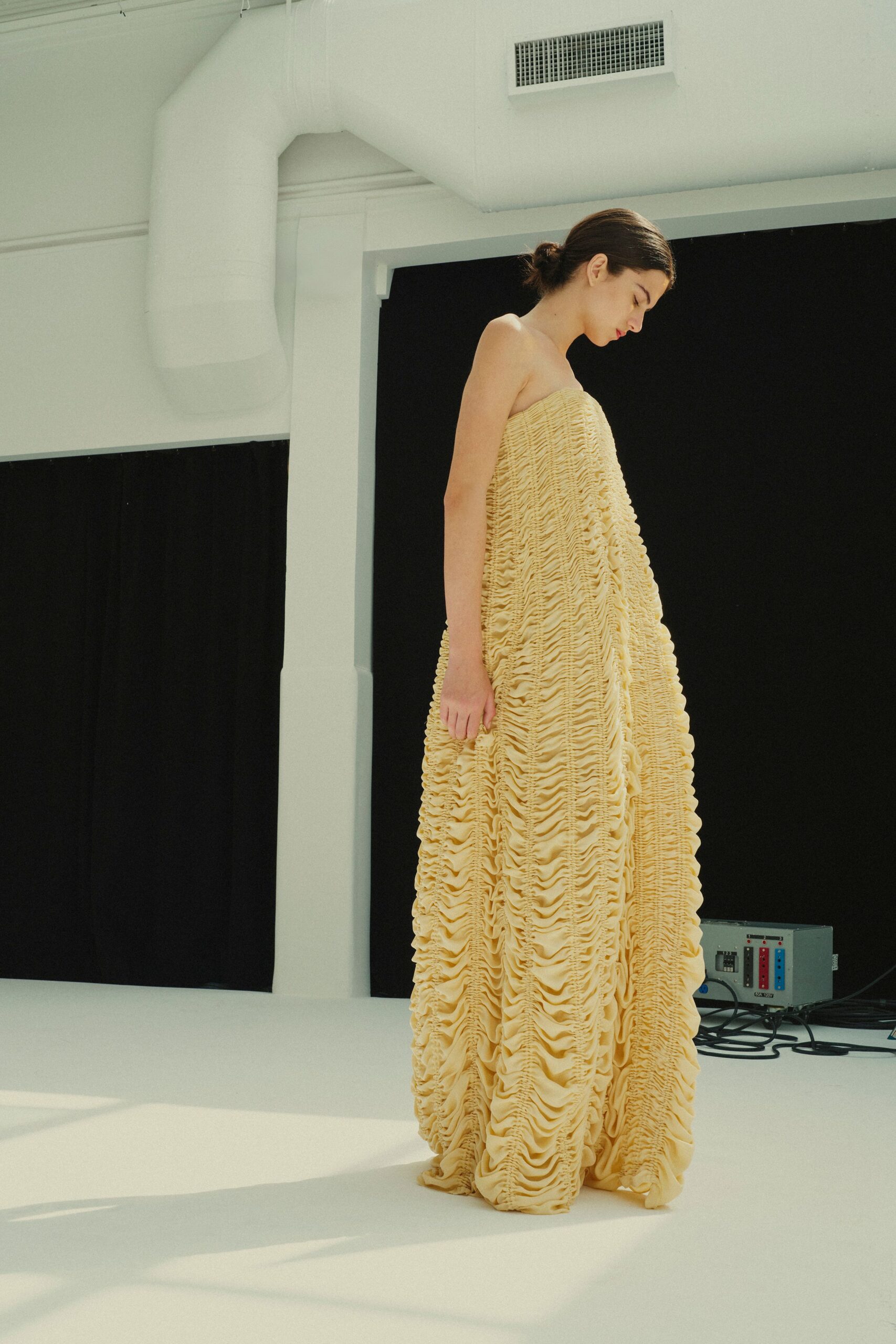 yellow ruffled strapless gown
