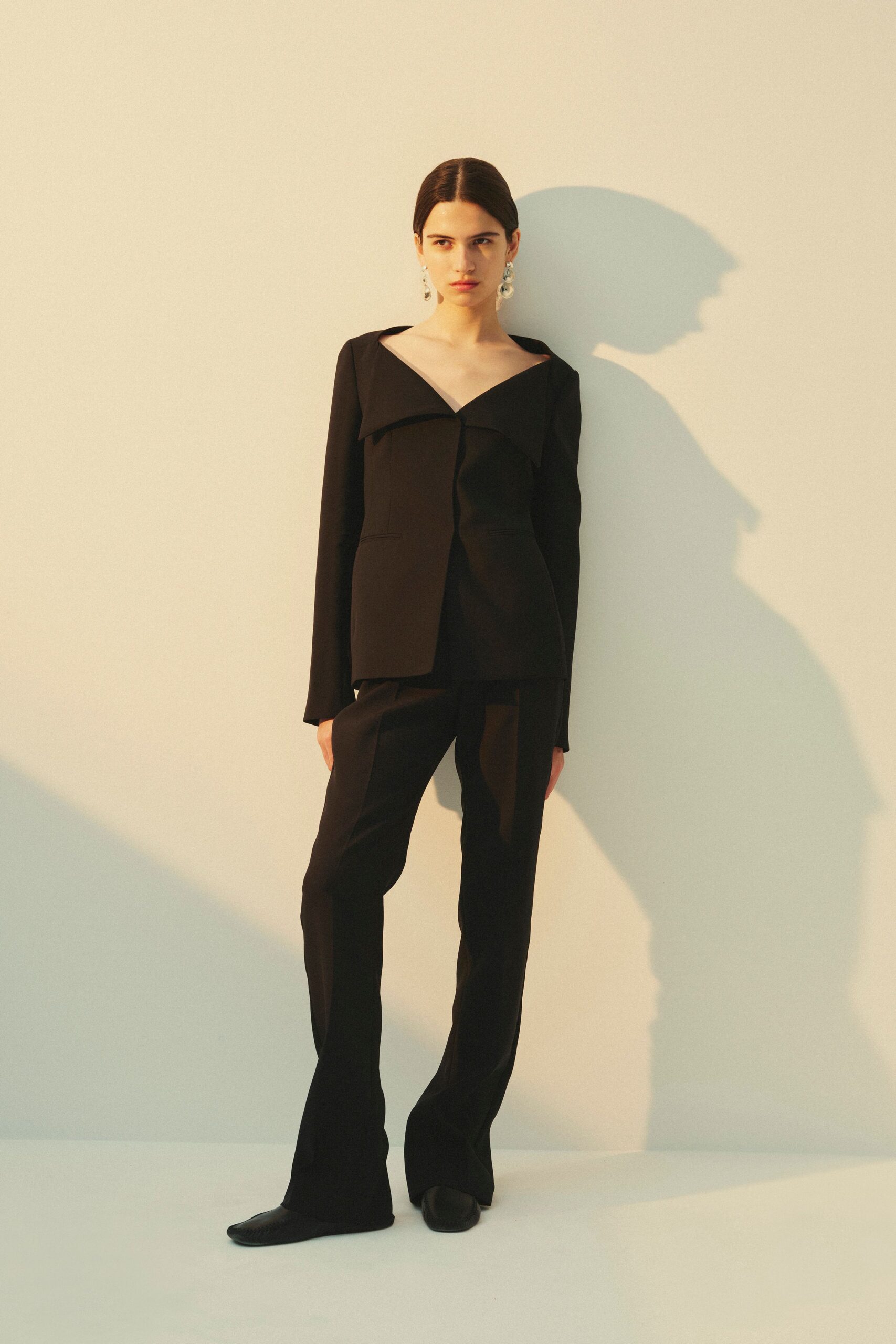 black cotton long-sleeve v-neck structured buttoned blazer