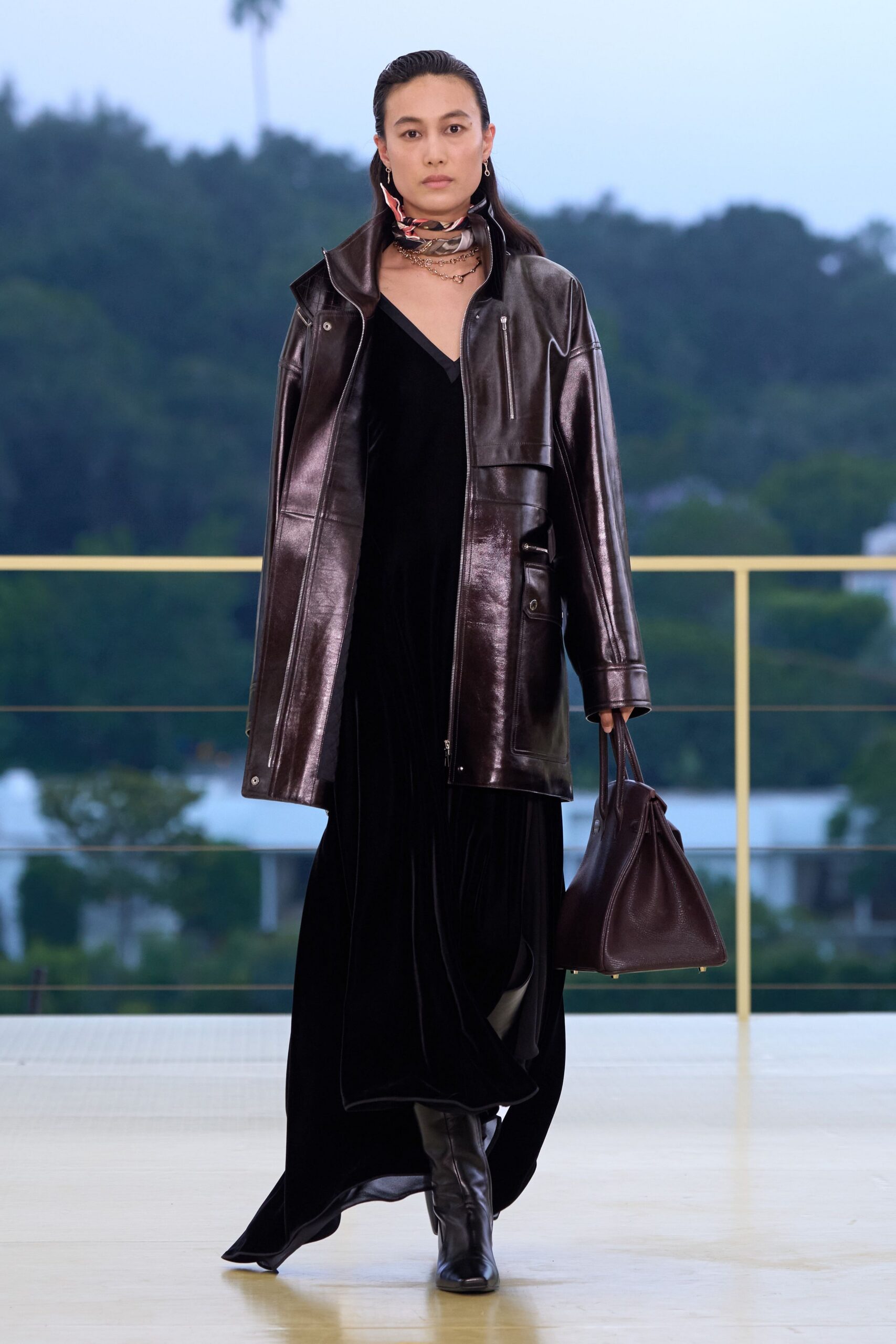 black leather long-sleeve collared relaxed zippered shiny coat