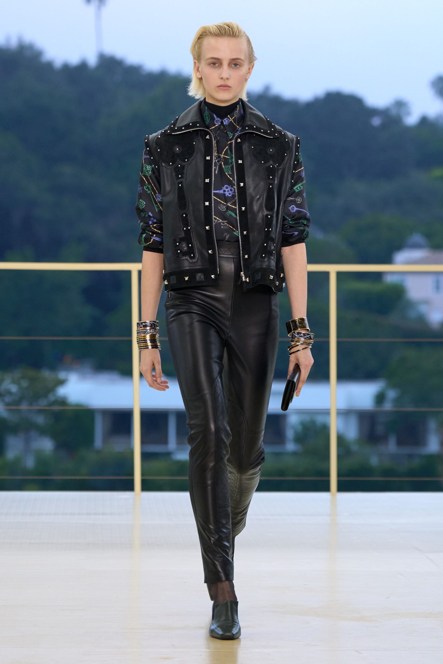 black leather long-sleeve collared fitted zippered buttoned jacket