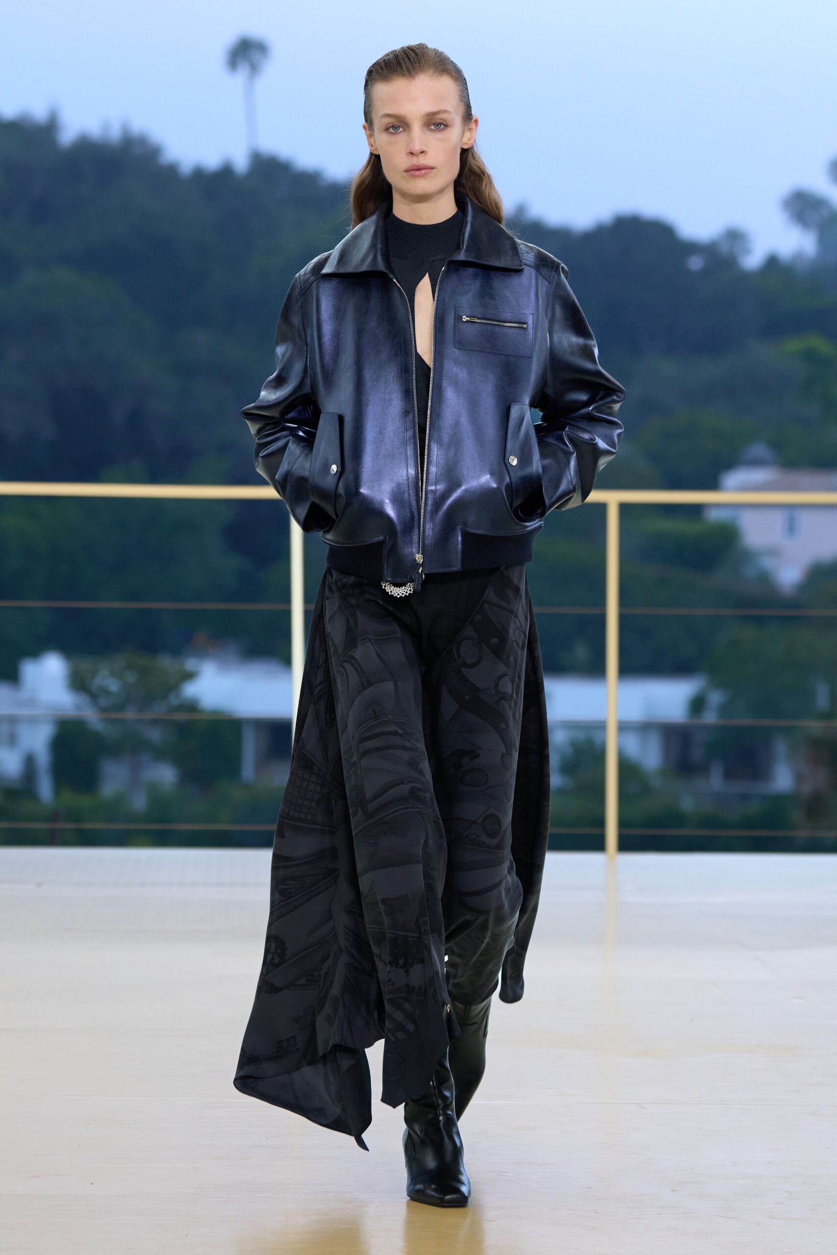 black leather long-sleeve collared fitted zippered shiny jacket