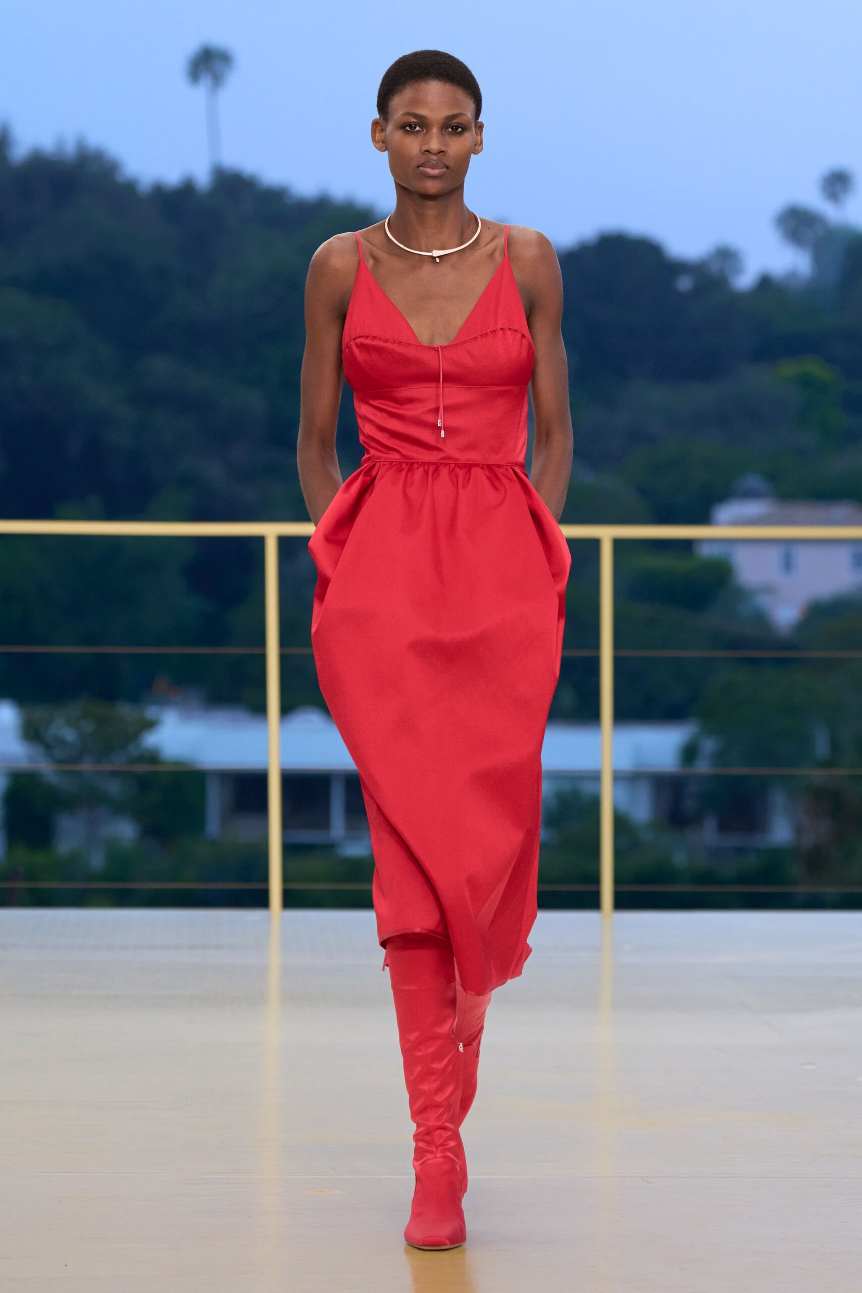 red cotton sleeveless v-neck fitted pleated midi dress