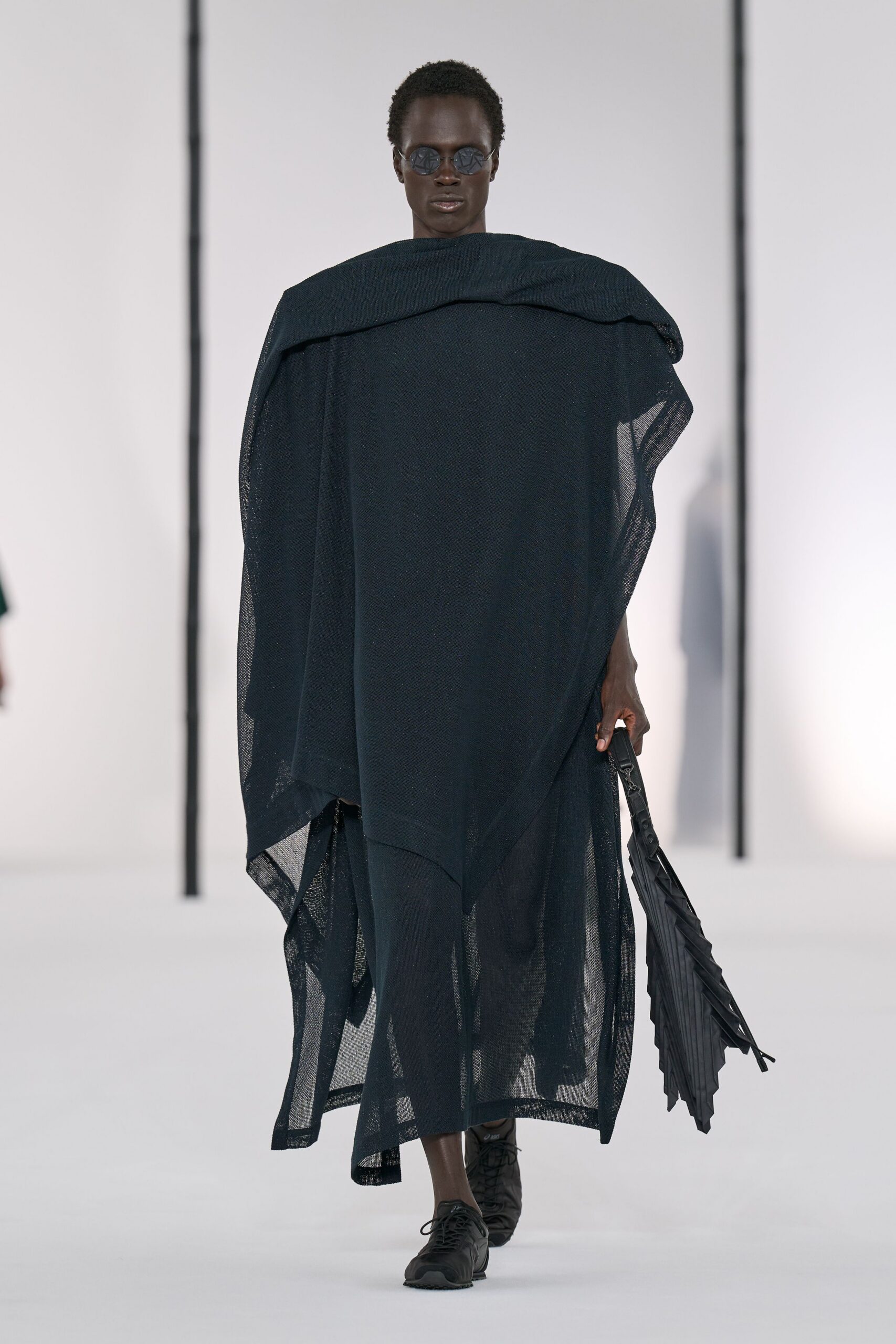 black relaxed poncho with fitted pants
